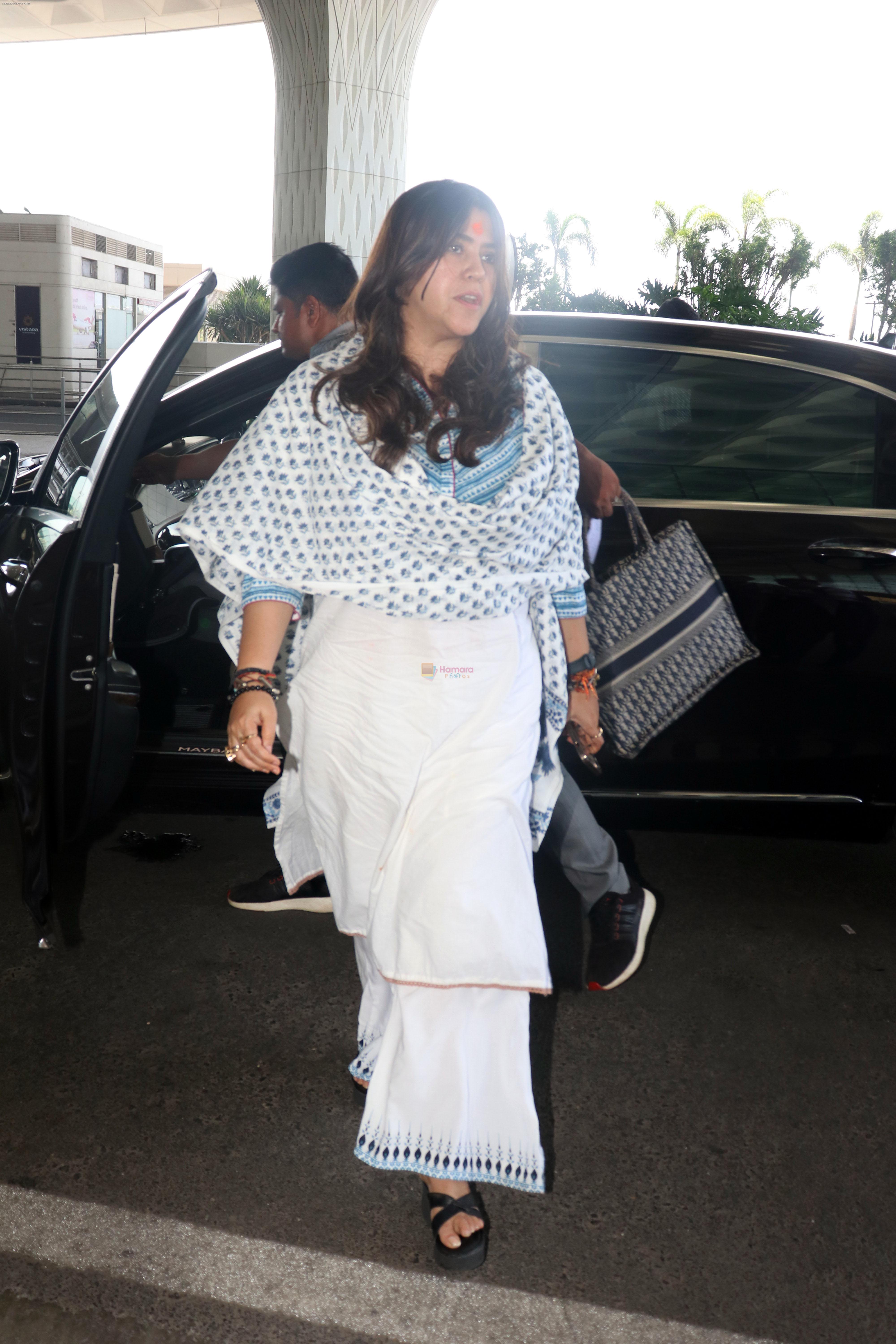 Ekta Kapoor in a white chudidar along with a Christian Dior Tote Blue Dior Oblique Embroidery purse