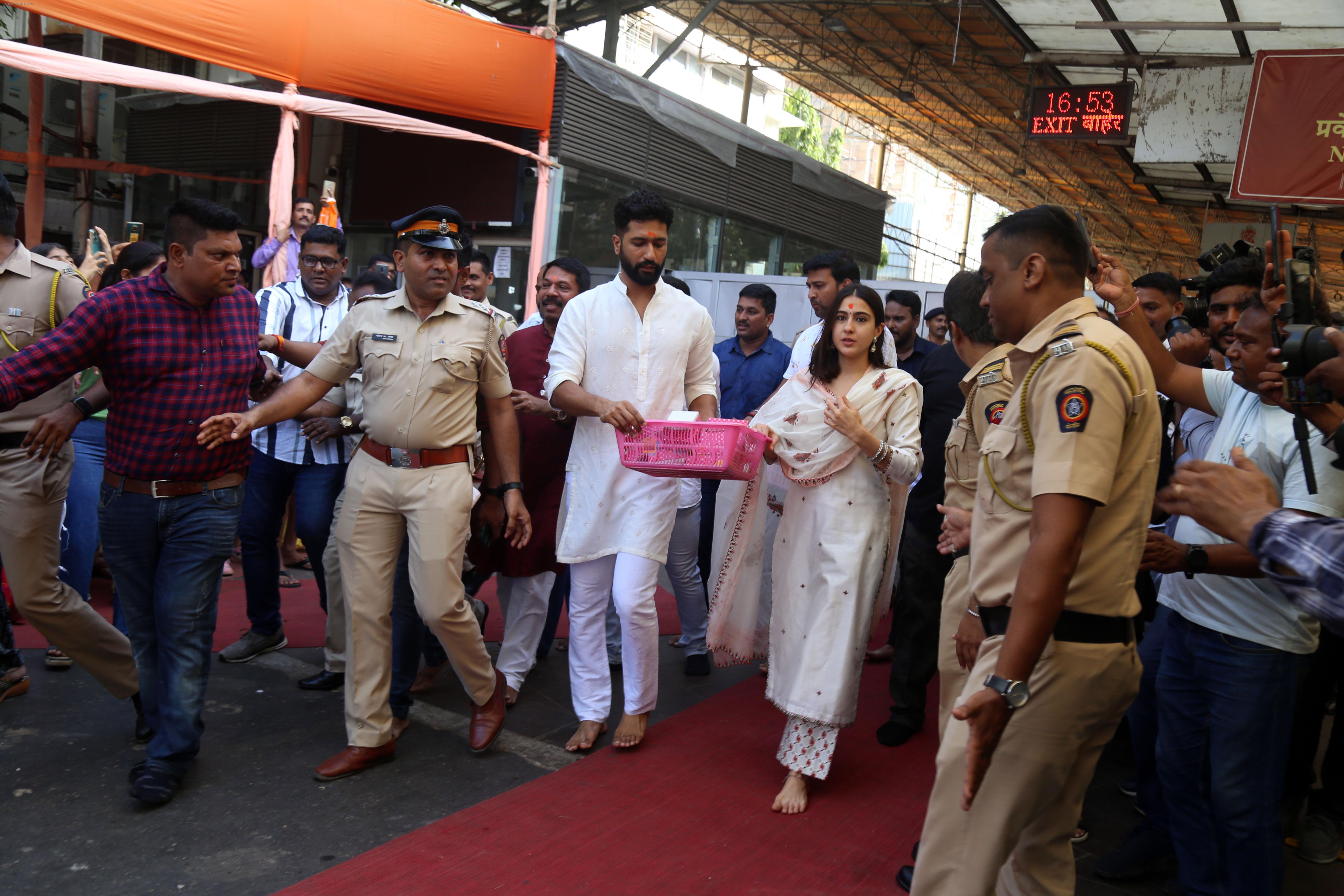 Vicky Kaushal And Sara Ali Khan distribute sweet packets at Shree Siddhivinayak Ganapati Mandir and seek blessings for their movie Zara Hatke Zara Bachke