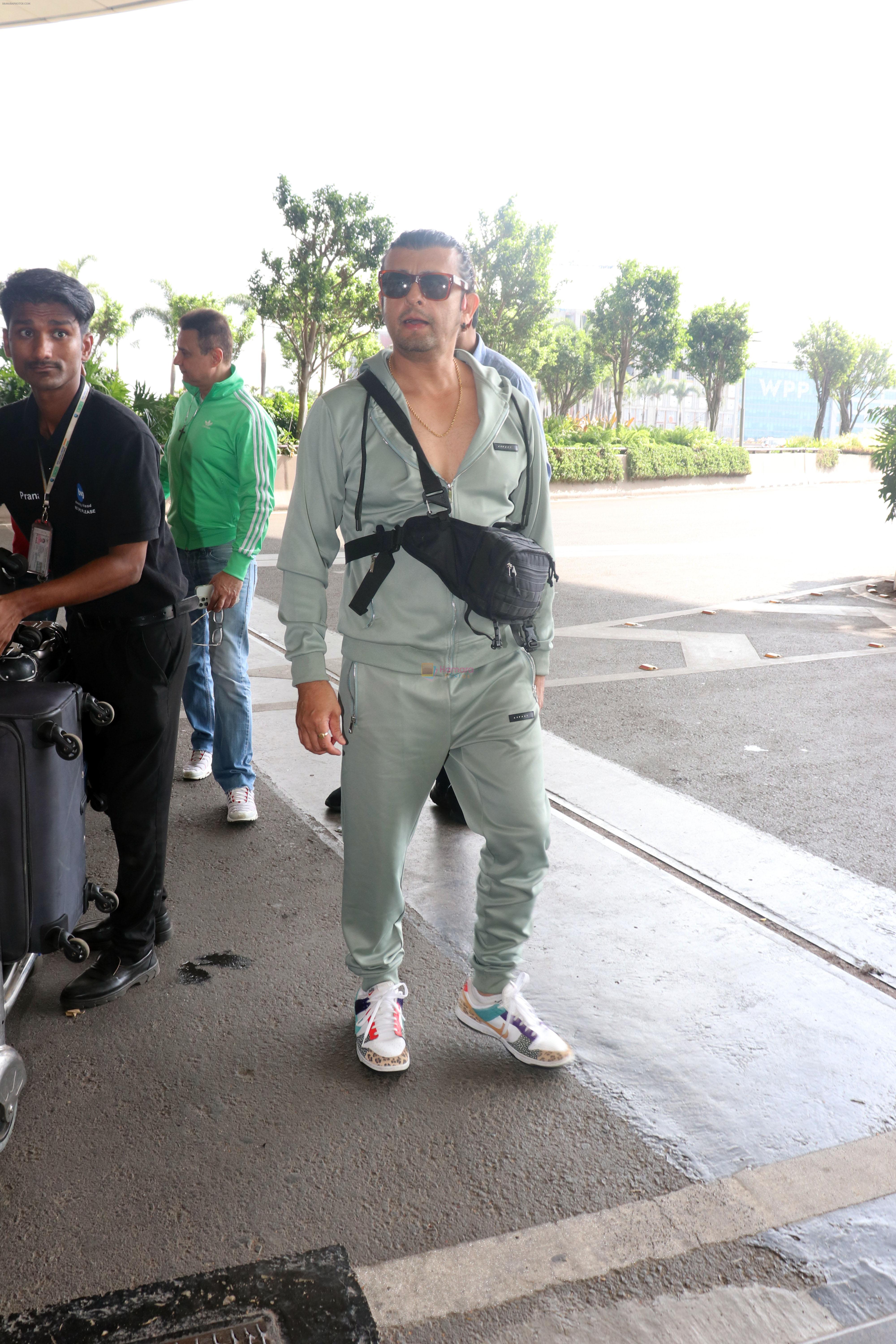 Sonu Nigam in sweat pant and jacket wearing sunglasses