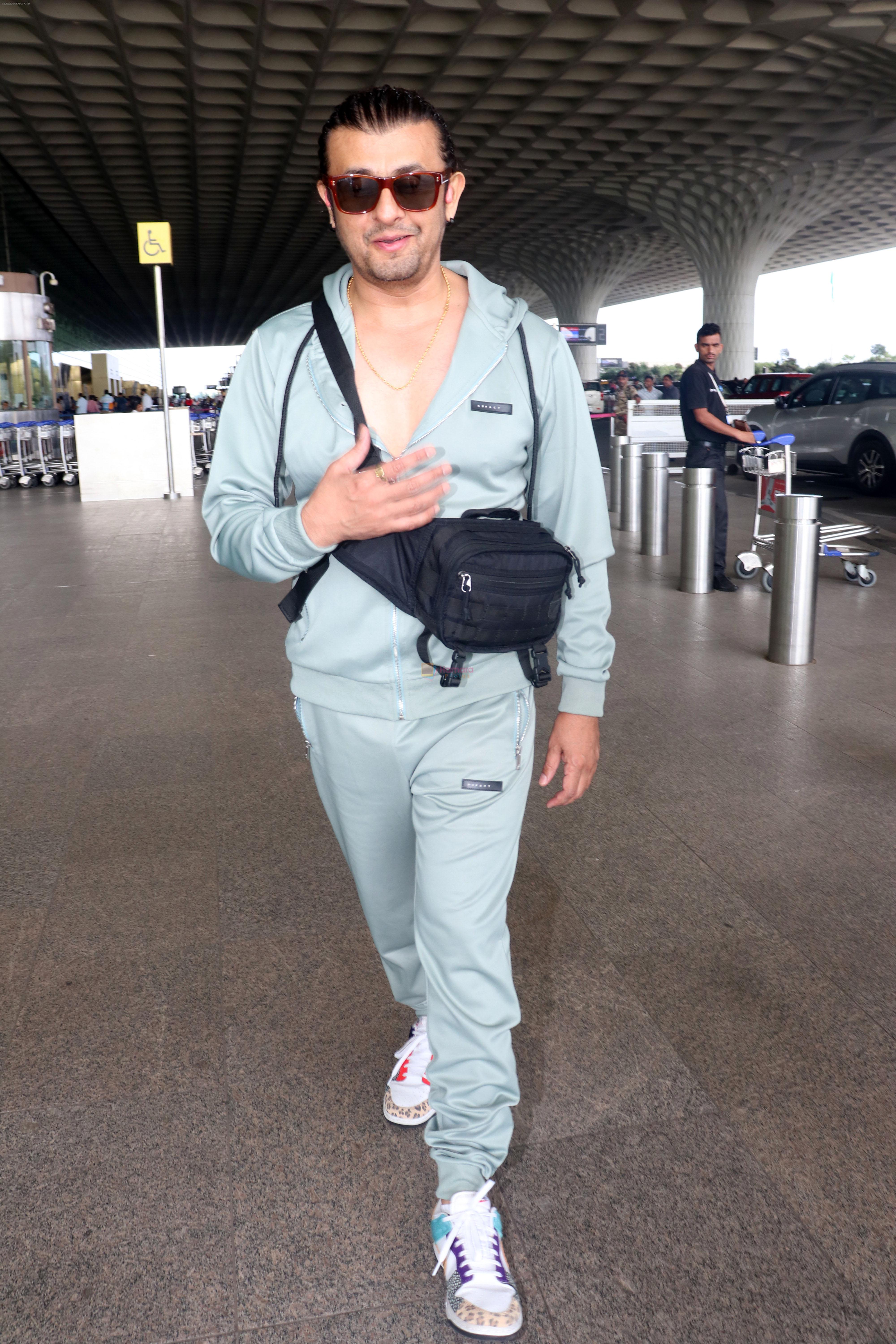 Sonu Nigam in sweat pant and jacket wearing sunglasses