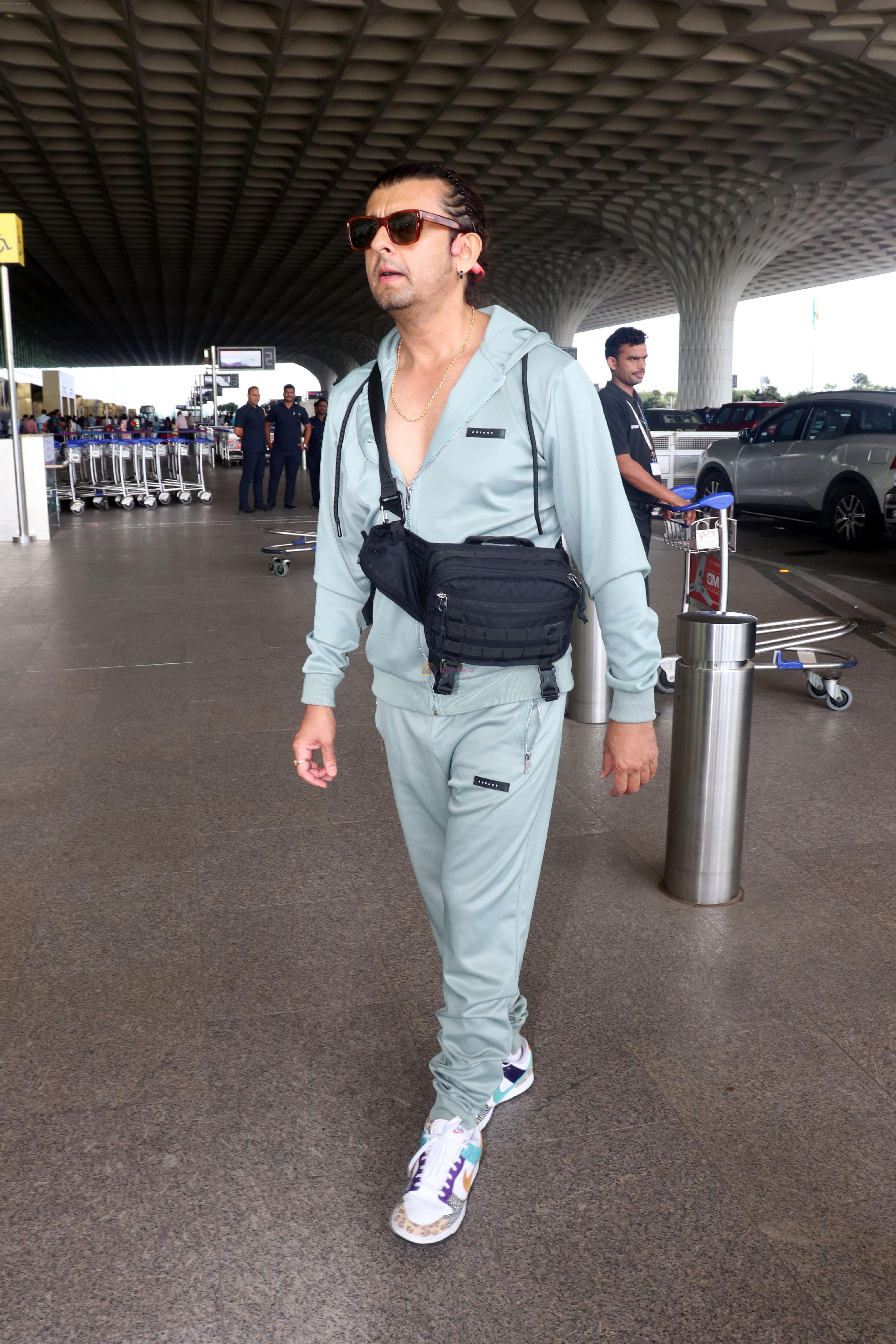 Sonu Nigam in sweat pant and jacket wearing sunglasses