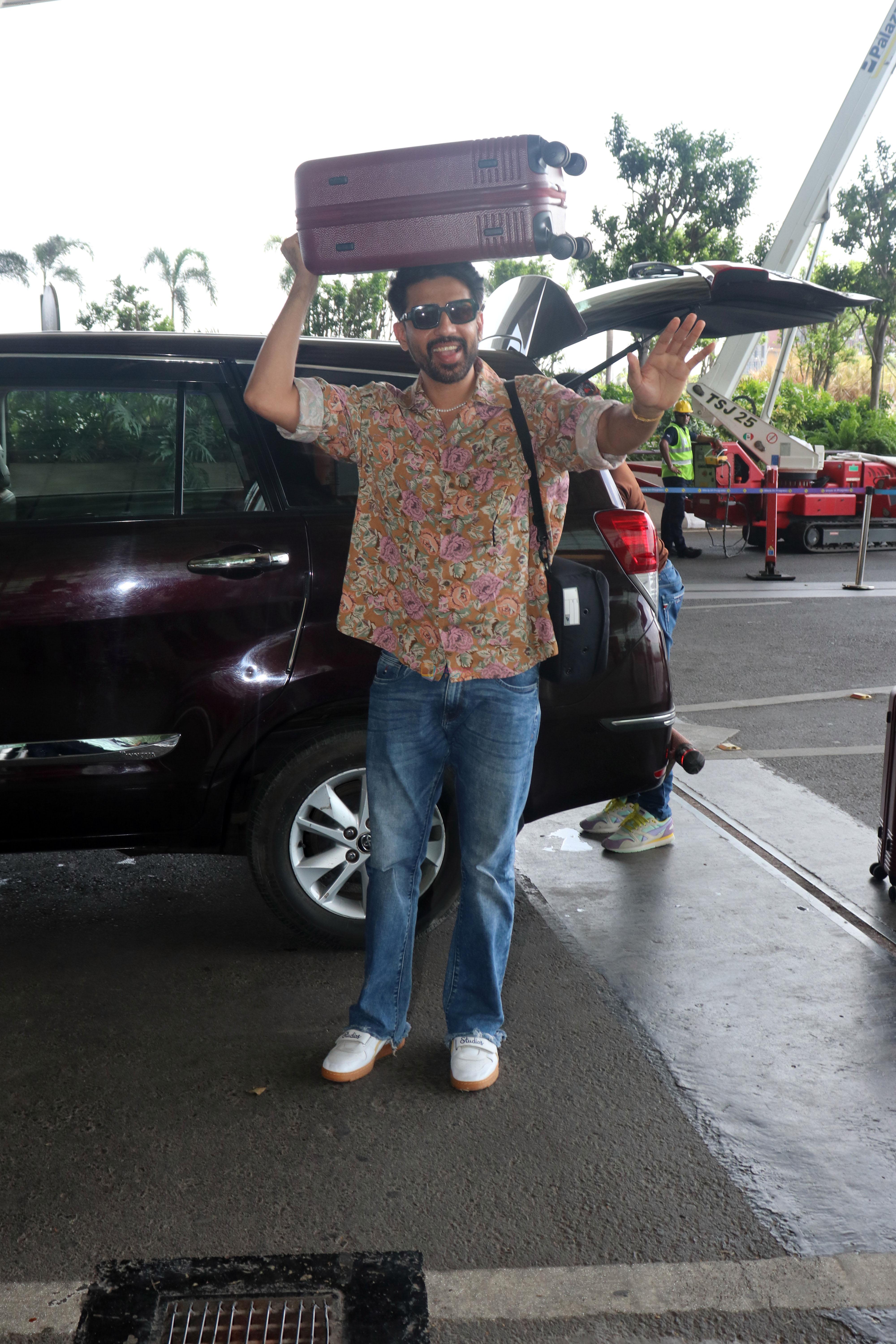 Gulshan Devaiah in a flowery shirt and jeans pant