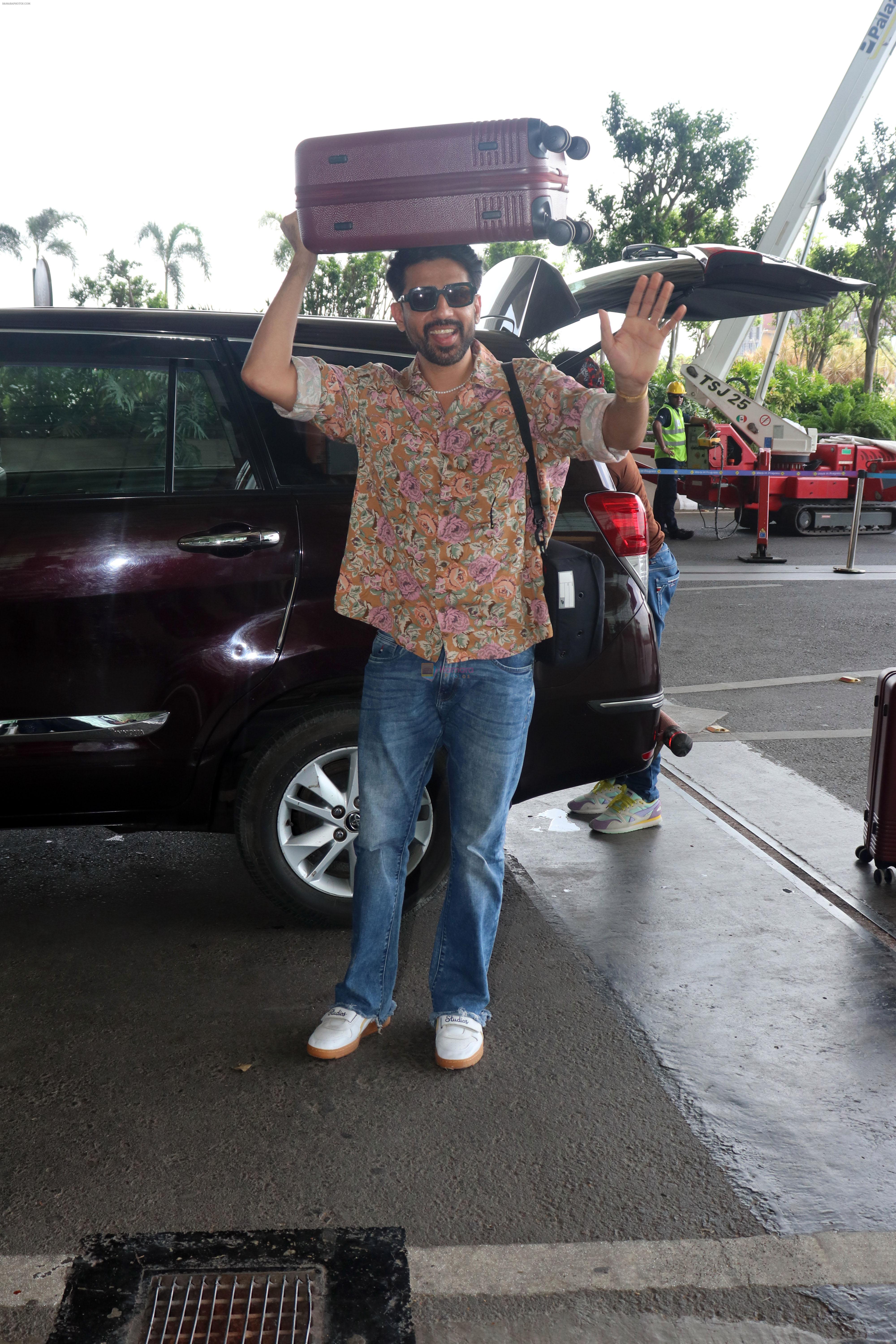 Gulshan Devaiah in a flowery shirt and jeans pant