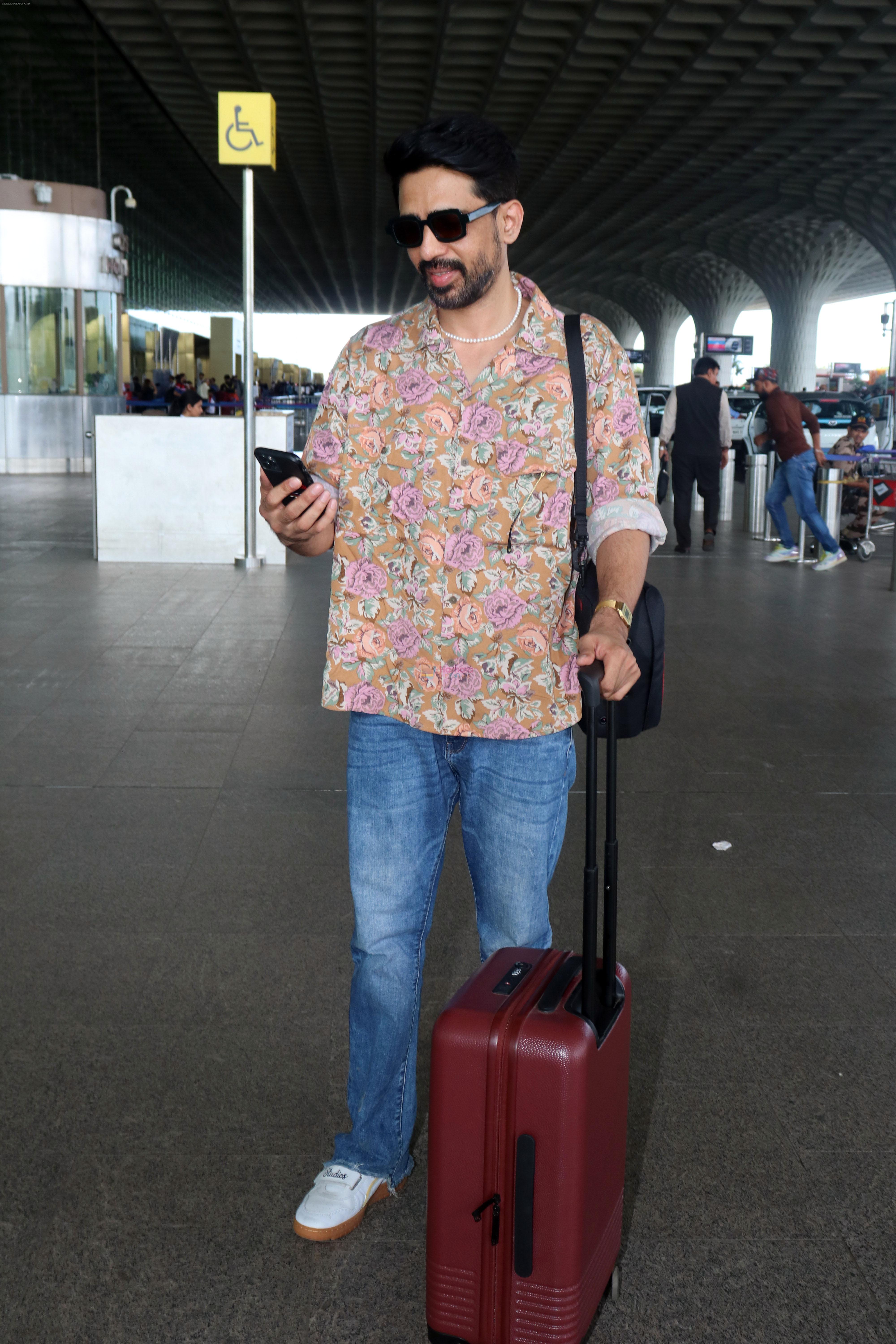 Gulshan Devaiah in a flowery shirt and jeans pant