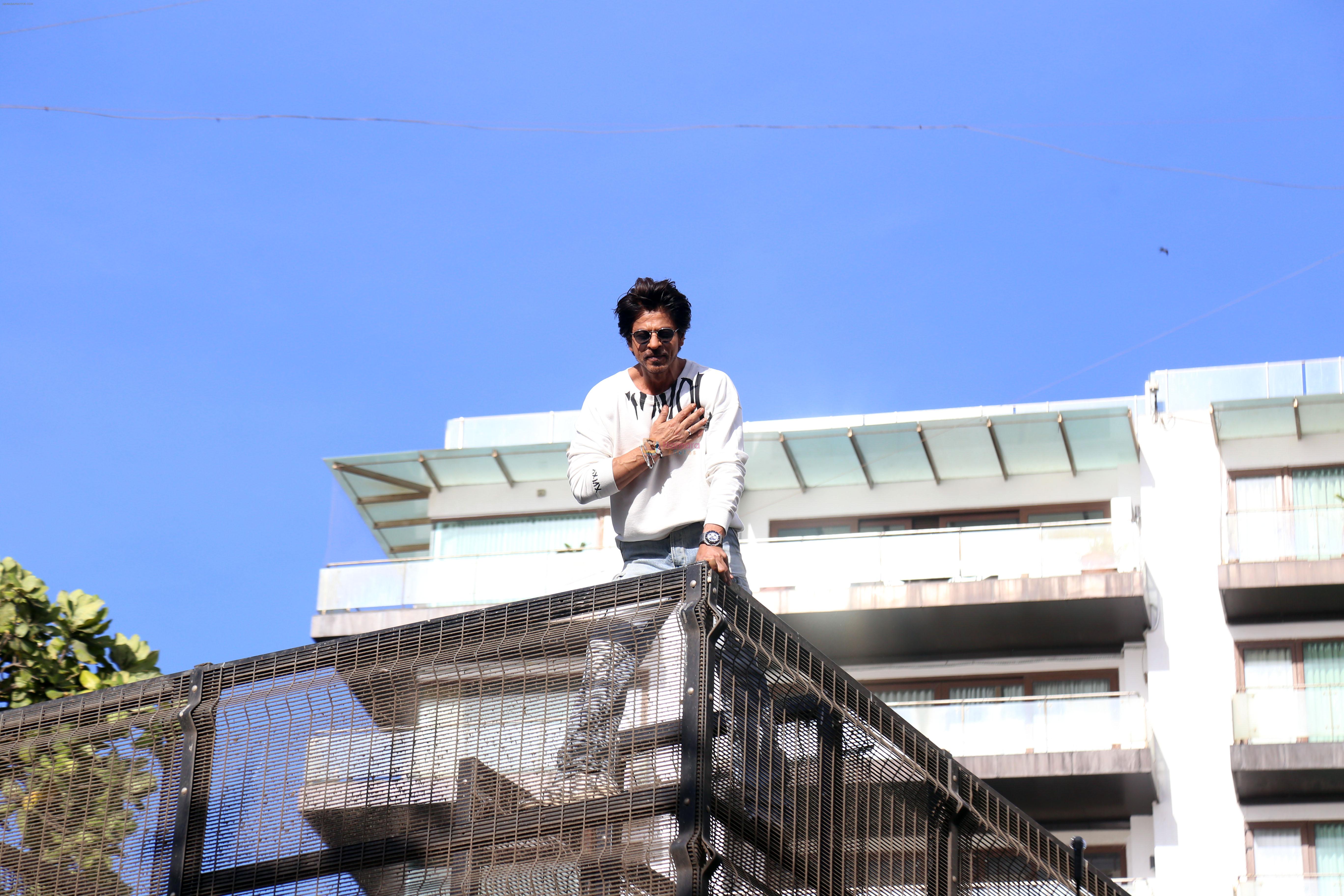 Shah Rukh Khan pose in celebration of the world TV premiere of his film Pathan