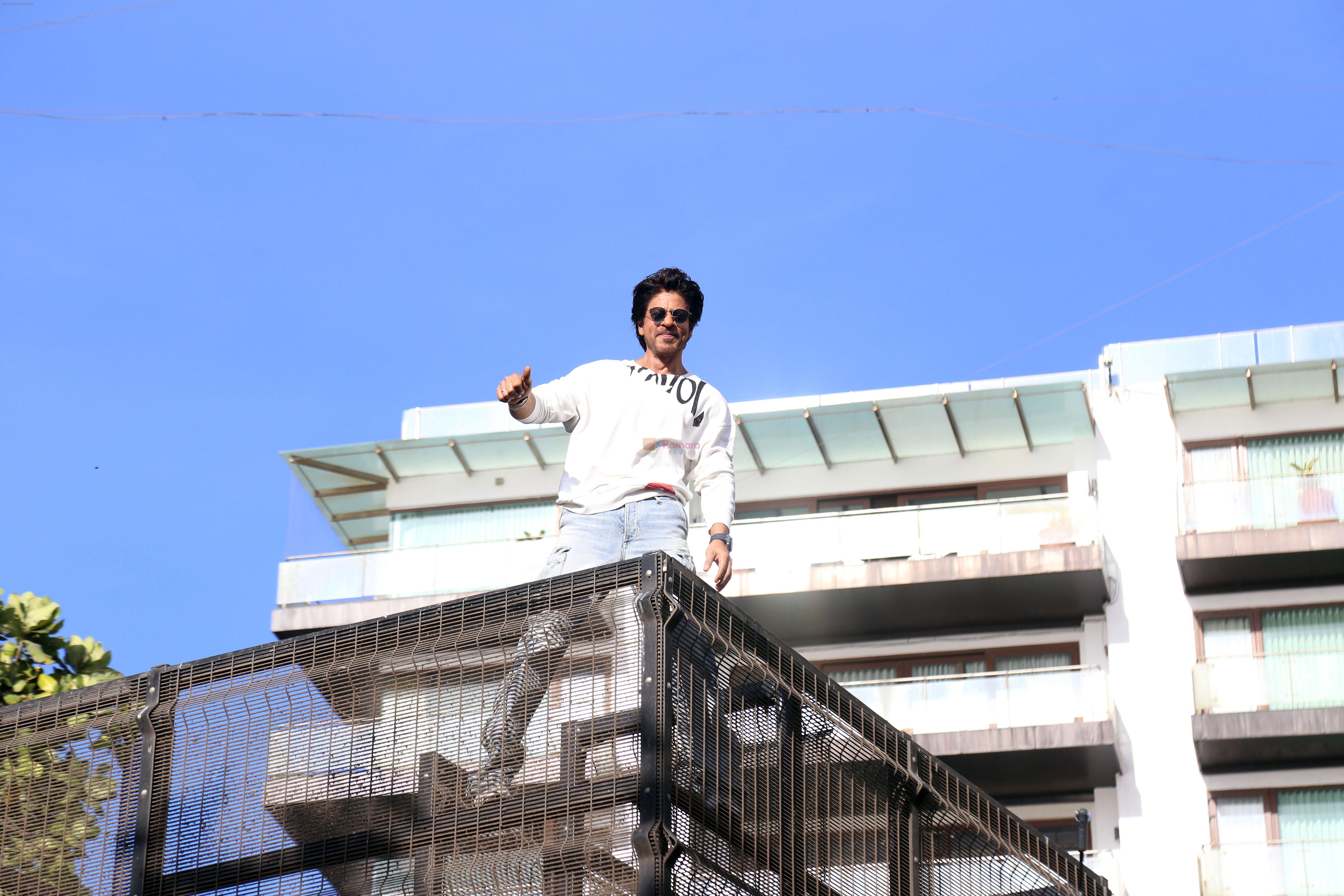 Shah Rukh Khan pose in celebration of the world TV premiere of his film Pathan