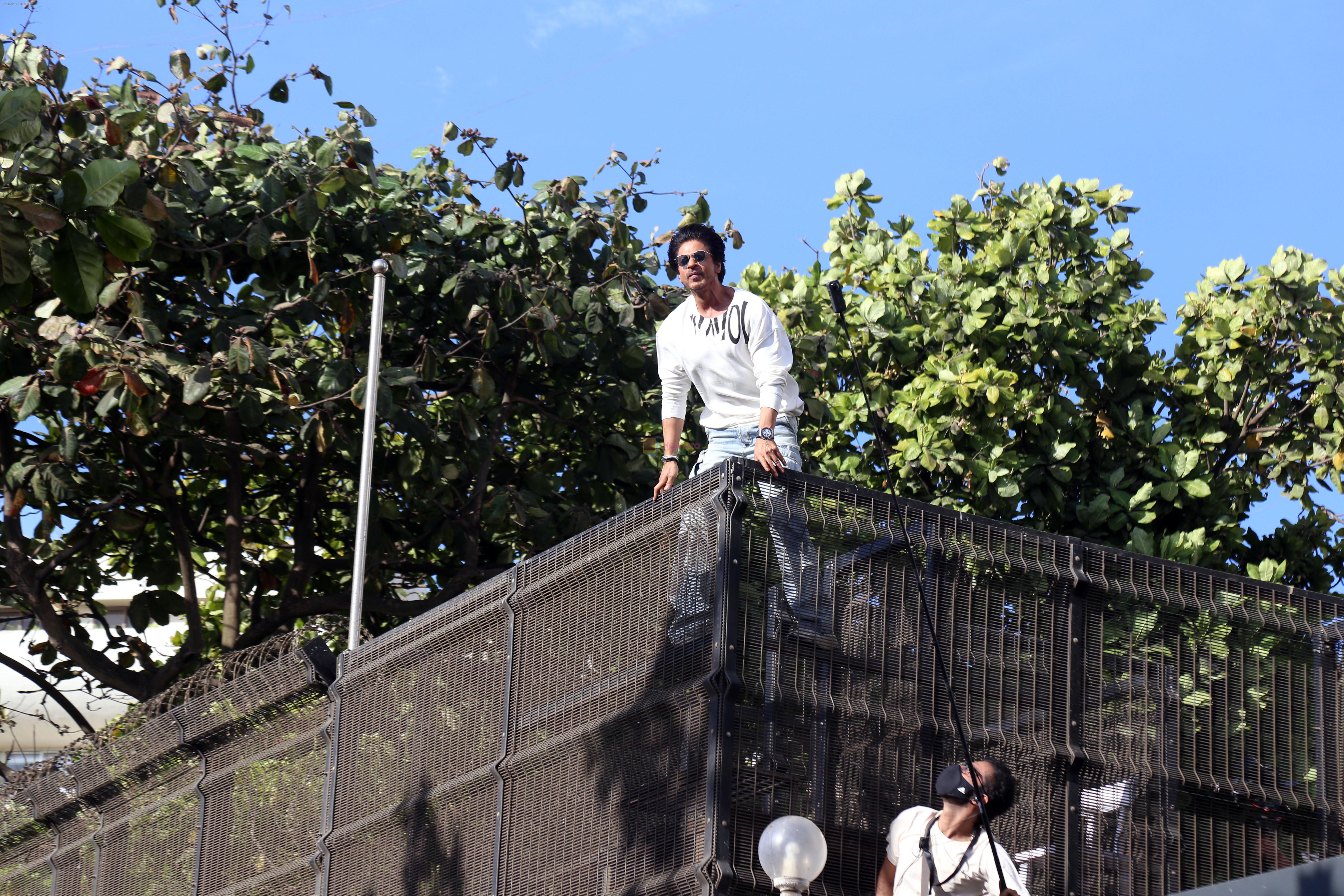 Shah Rukh Khan pose in celebration of the world TV premiere of his film Pathan