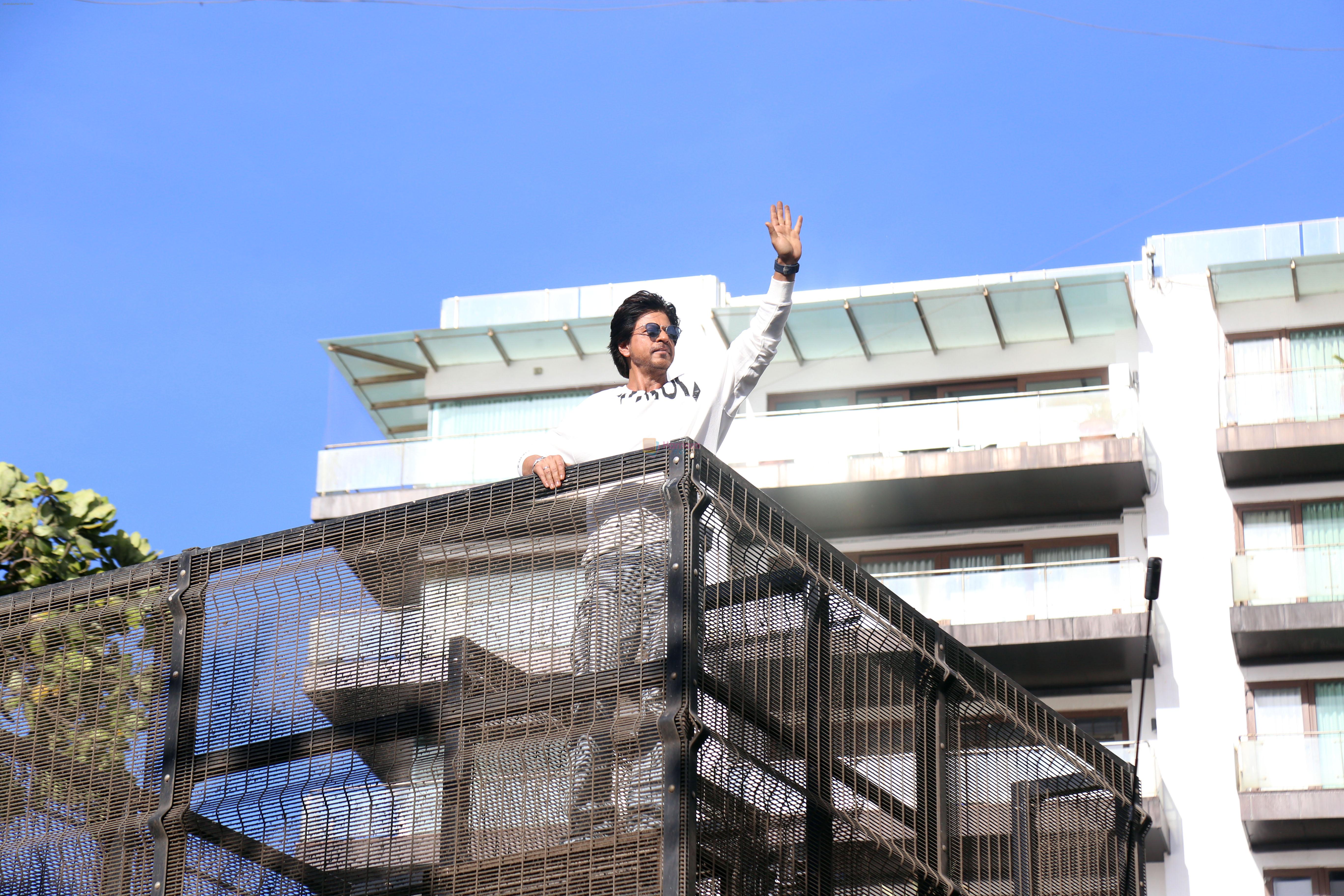 Shah Rukh Khan pose in celebration of the world TV premiere of his film Pathan