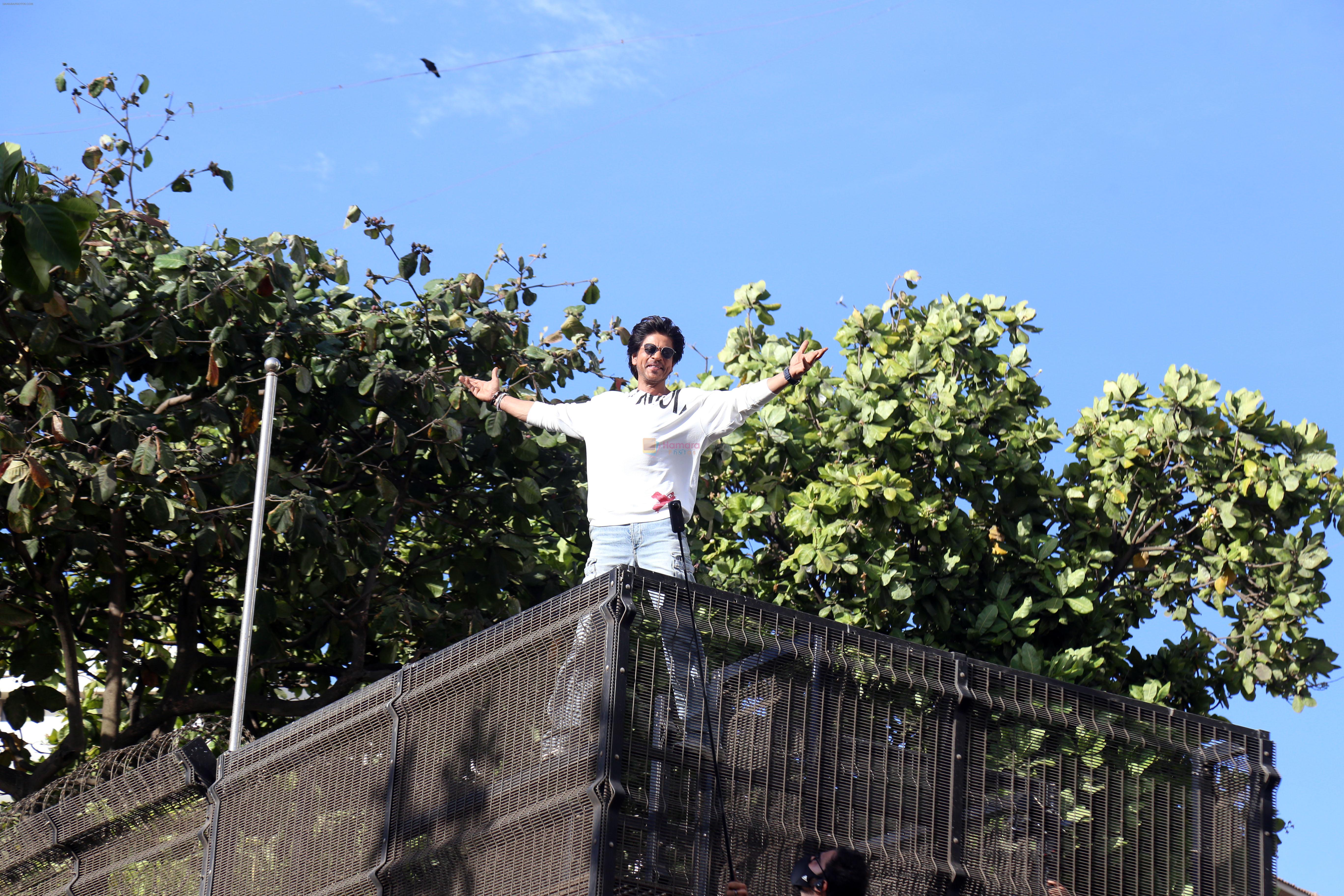 Shah Rukh Khan pose in celebration of the world TV premiere of his film Pathan