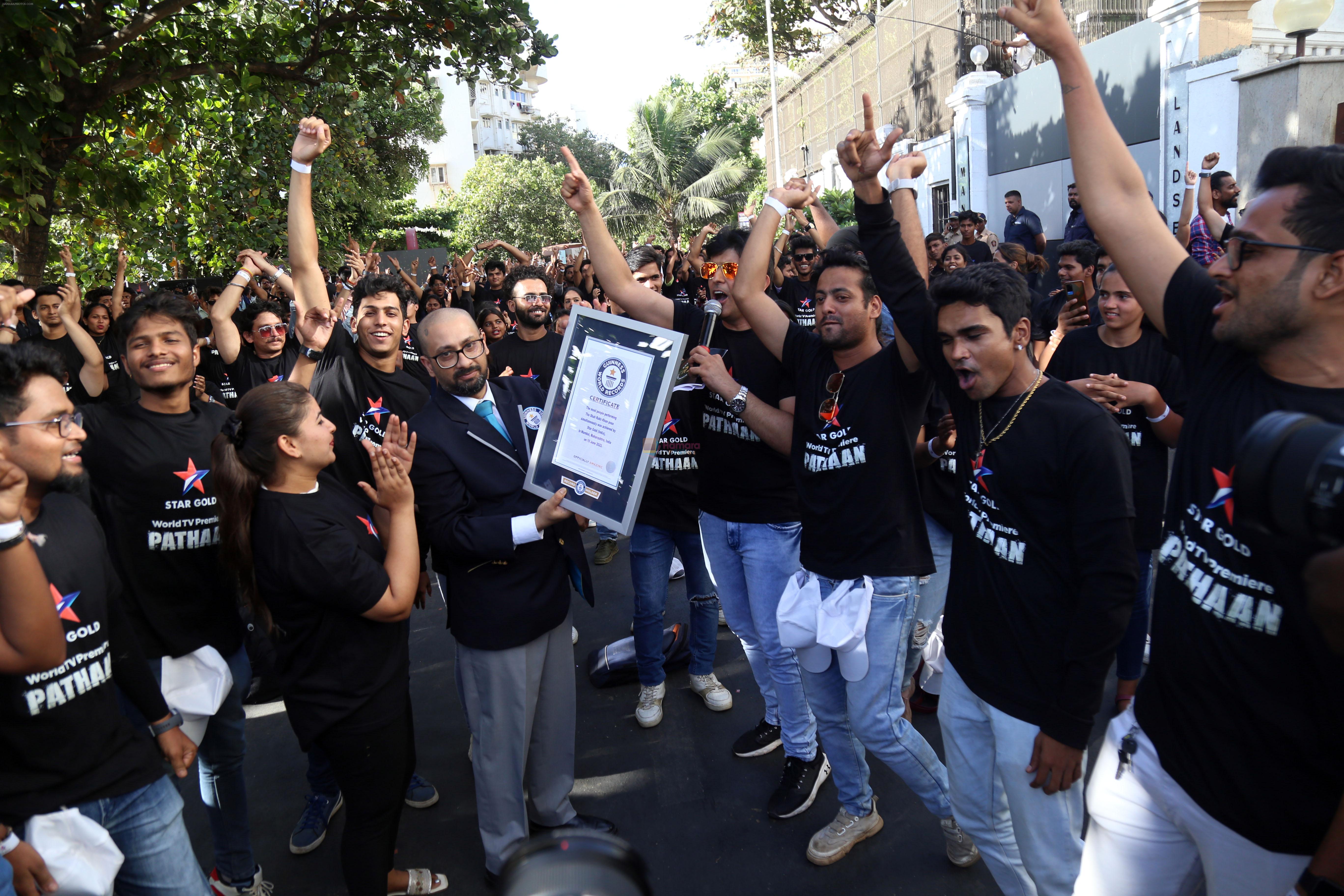 Shah Rukh Khan pose in celebration of the world TV premiere of his film Pathan