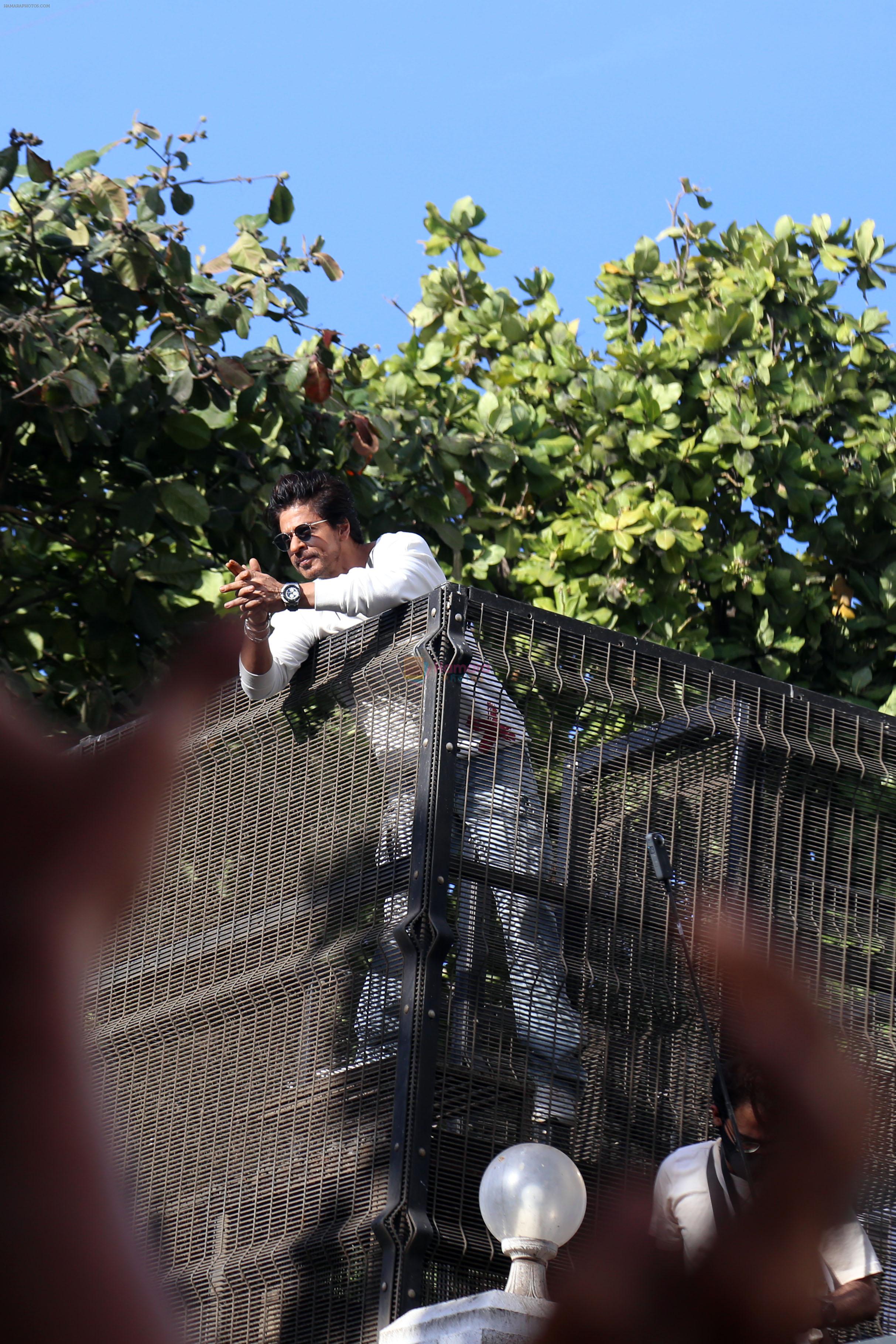 Shah Rukh Khan pose in celebration of the world TV premiere of his film Pathan