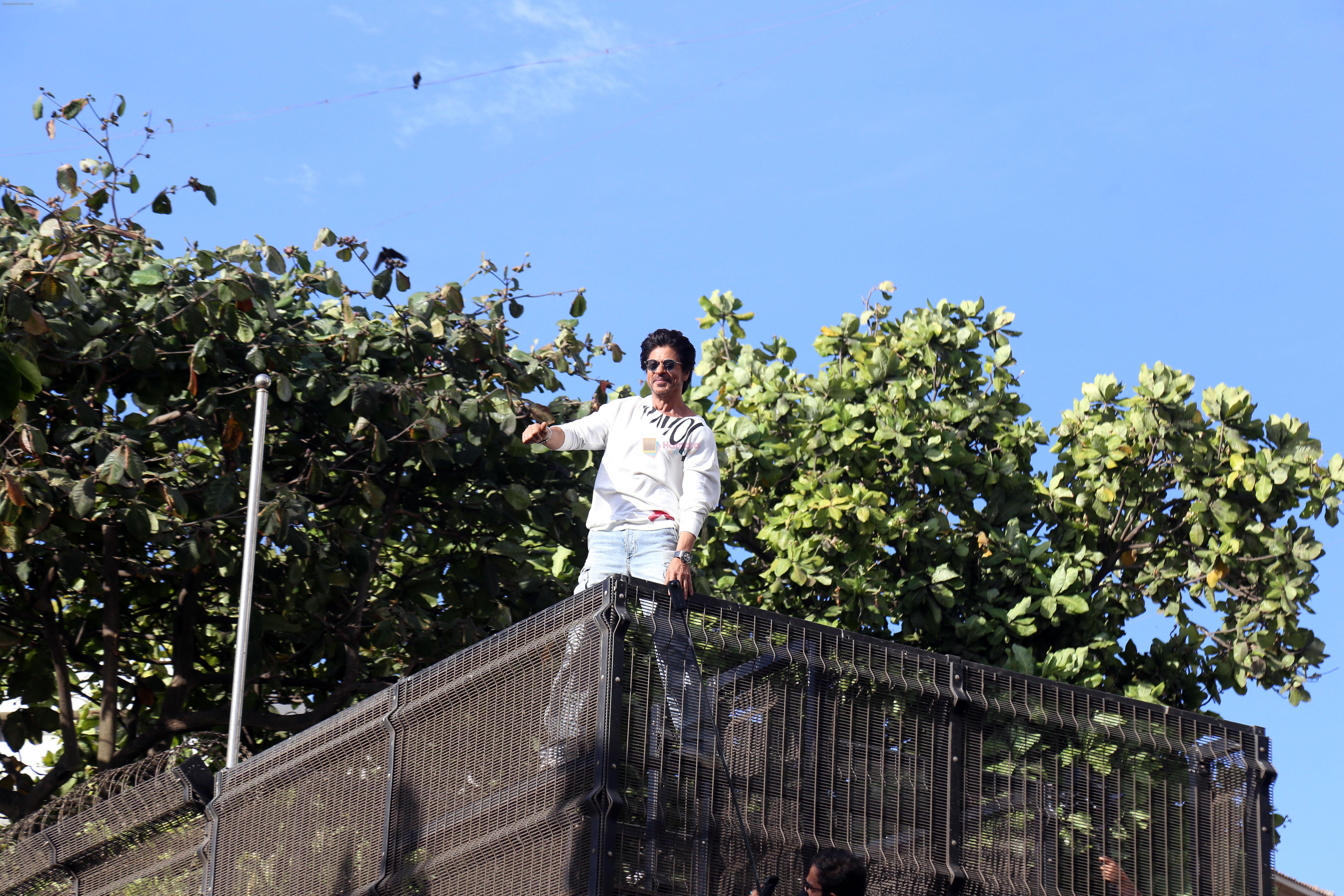 Shah Rukh Khan pose in celebration of the world TV premiere of his film Pathan