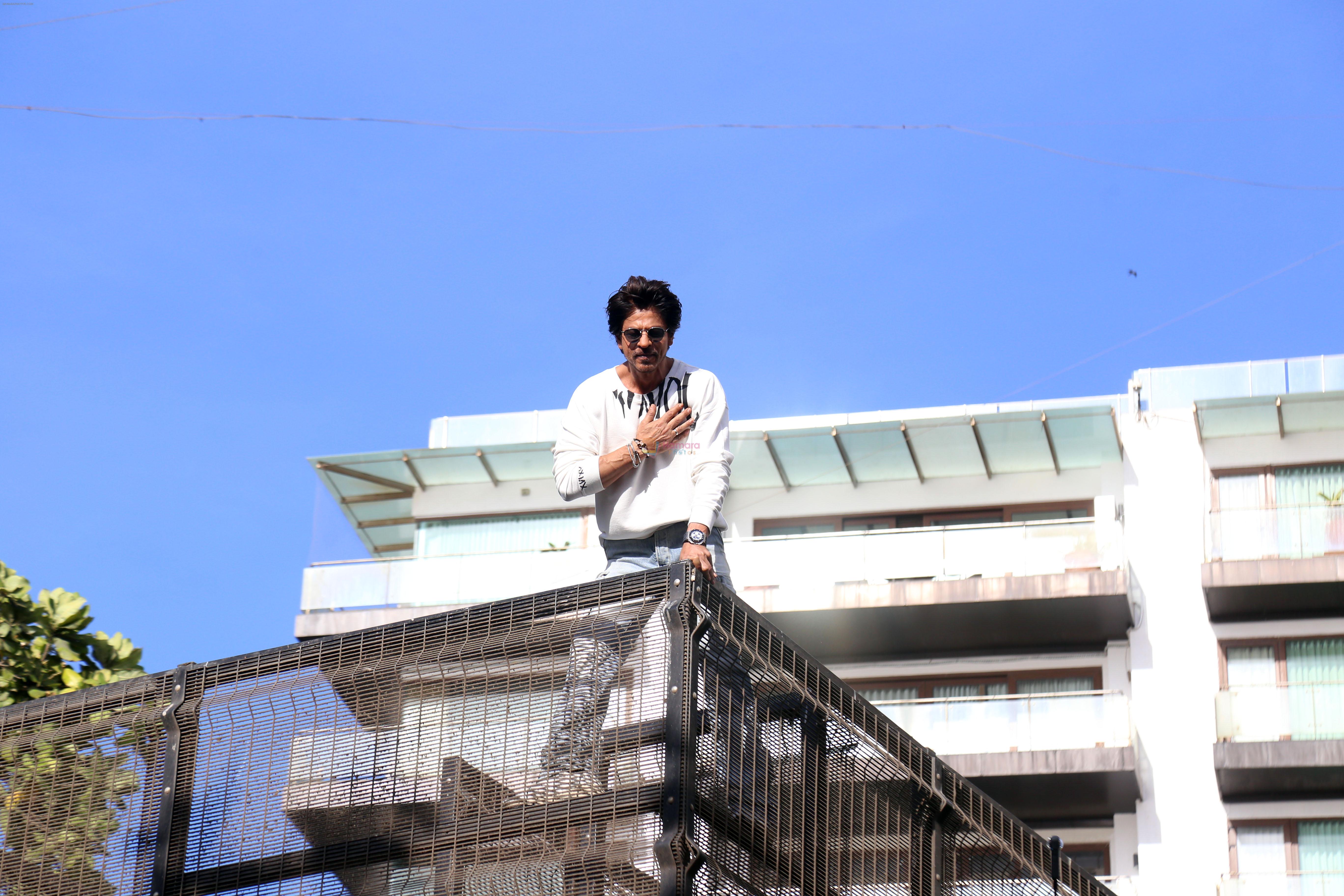 Shah Rukh Khan pose in celebration of the world TV premiere of his film Pathan