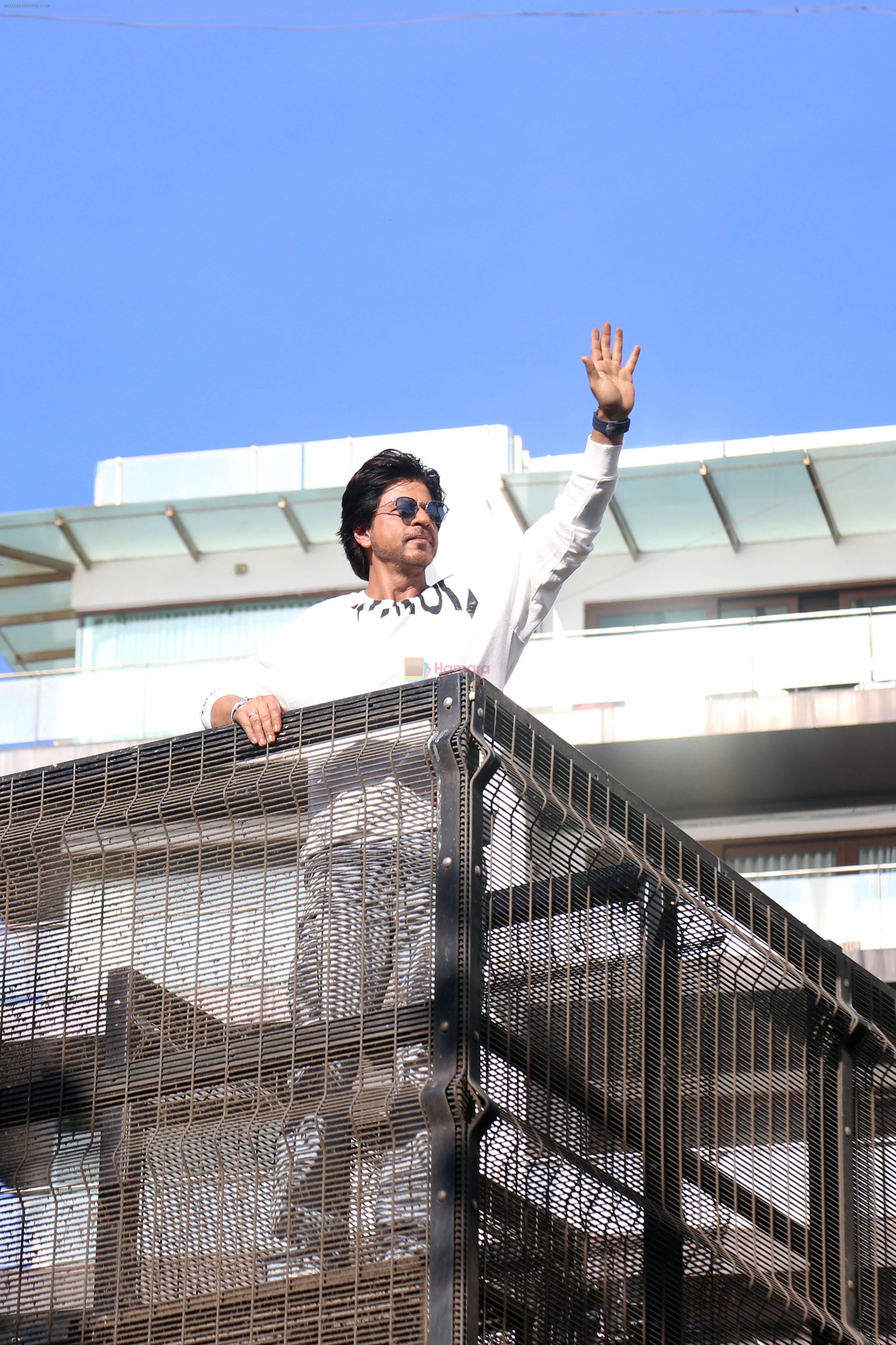Shah Rukh Khan pose in celebration of the world TV premiere of his film Pathan