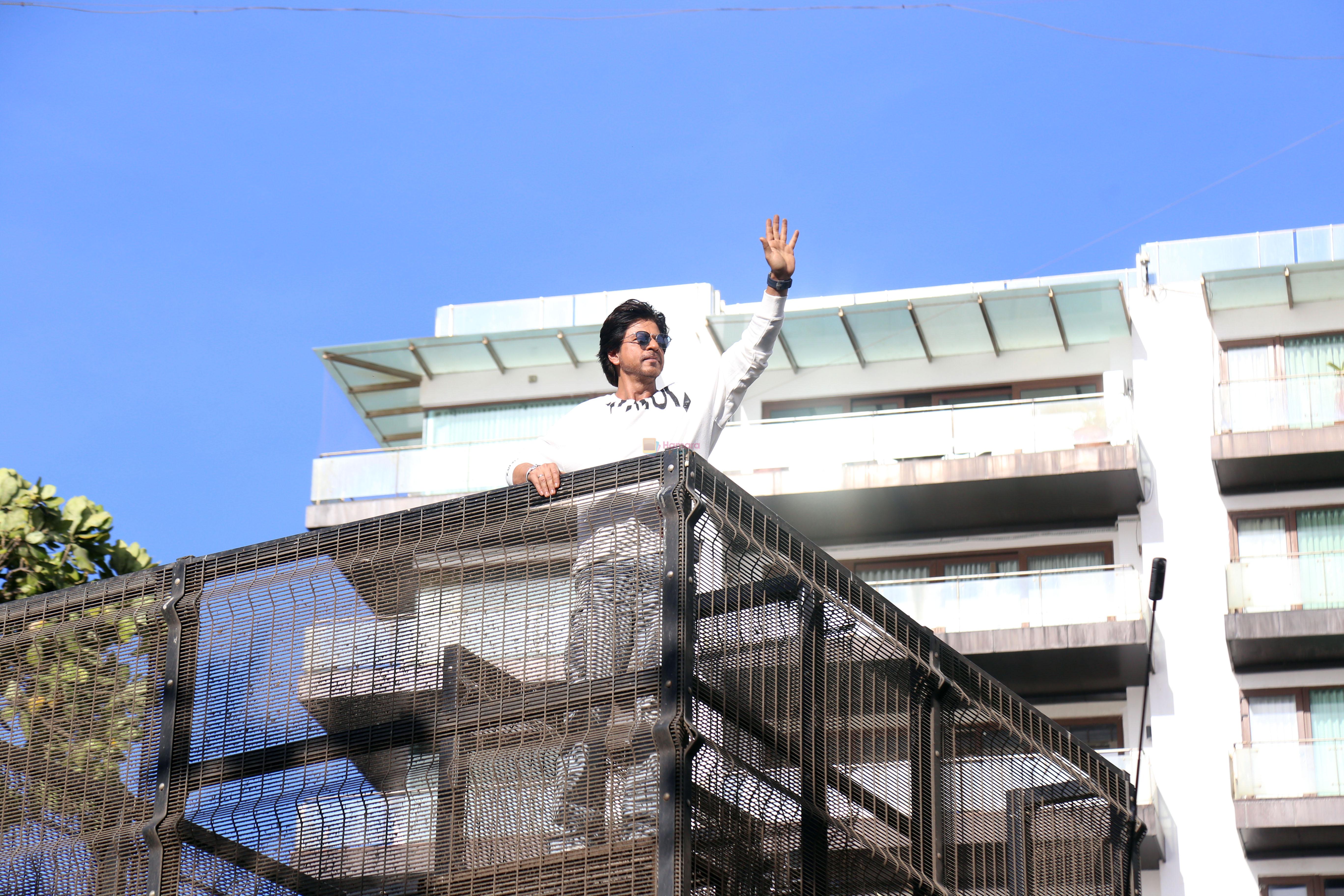 Shah Rukh Khan pose in celebration of the world TV premiere of his film Pathan