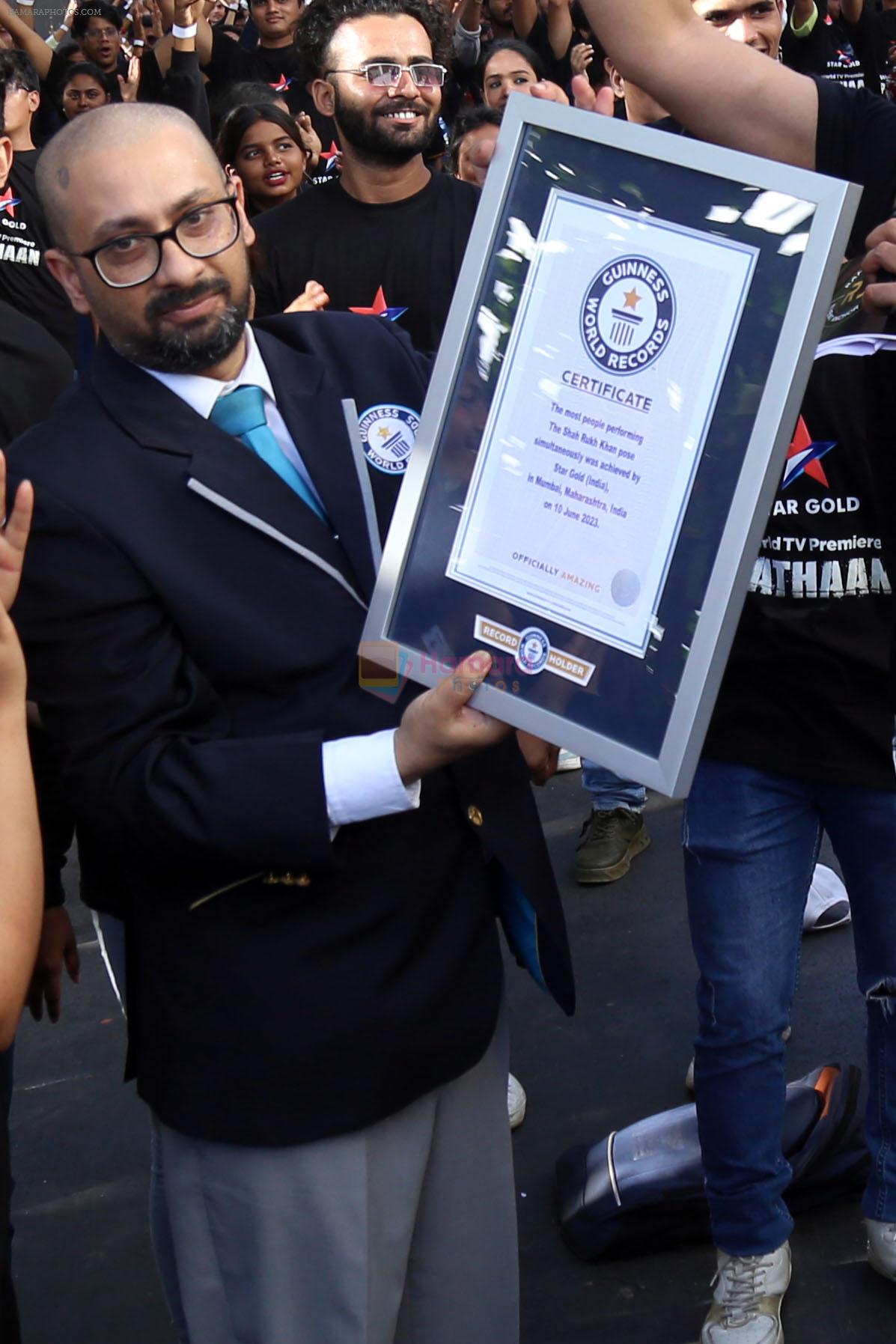 Shah Rukh Khan pose in celebration of the world TV premiere of his film Pathan