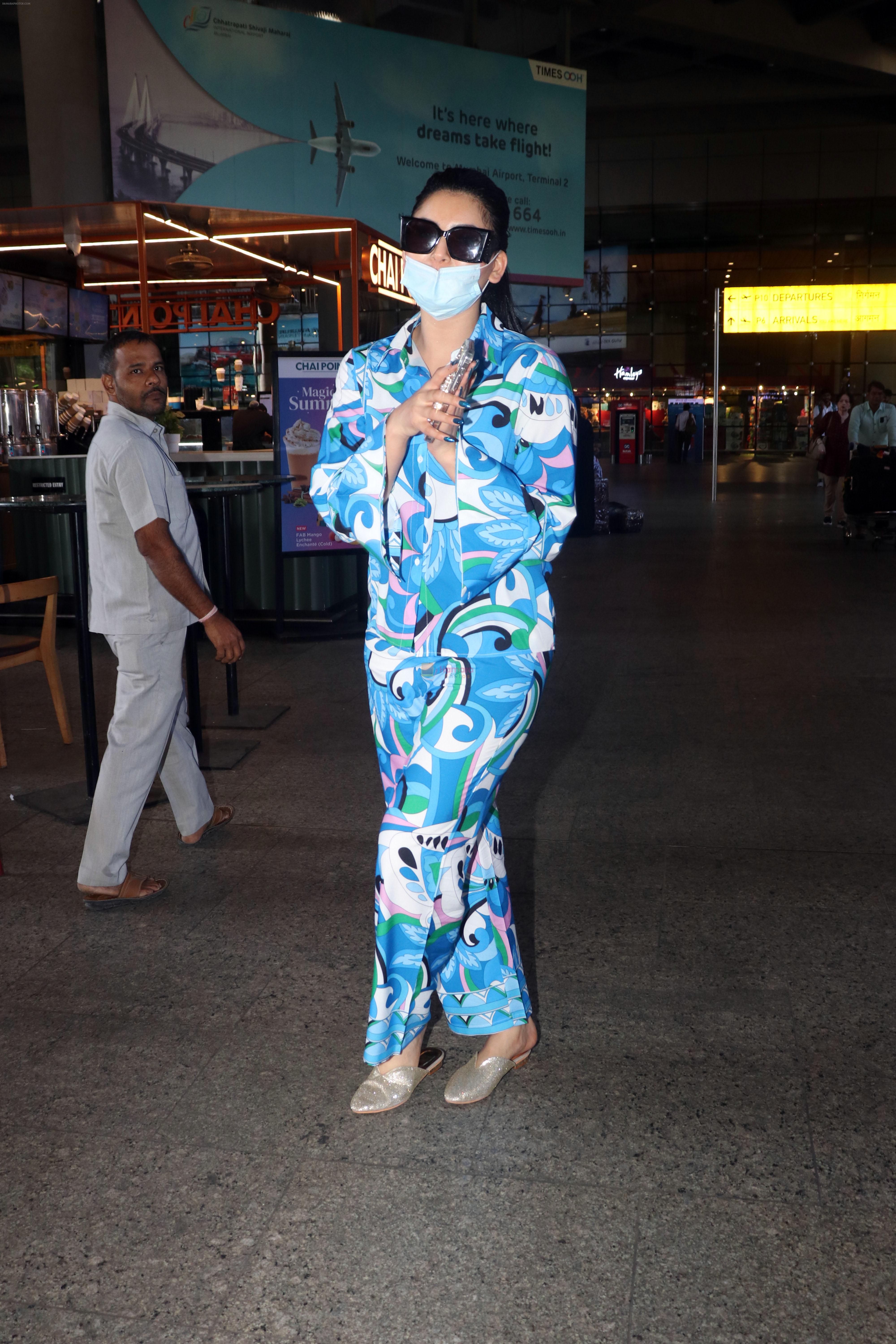 Urvashi Rautela dressed in blue night suit mask and sunglasses