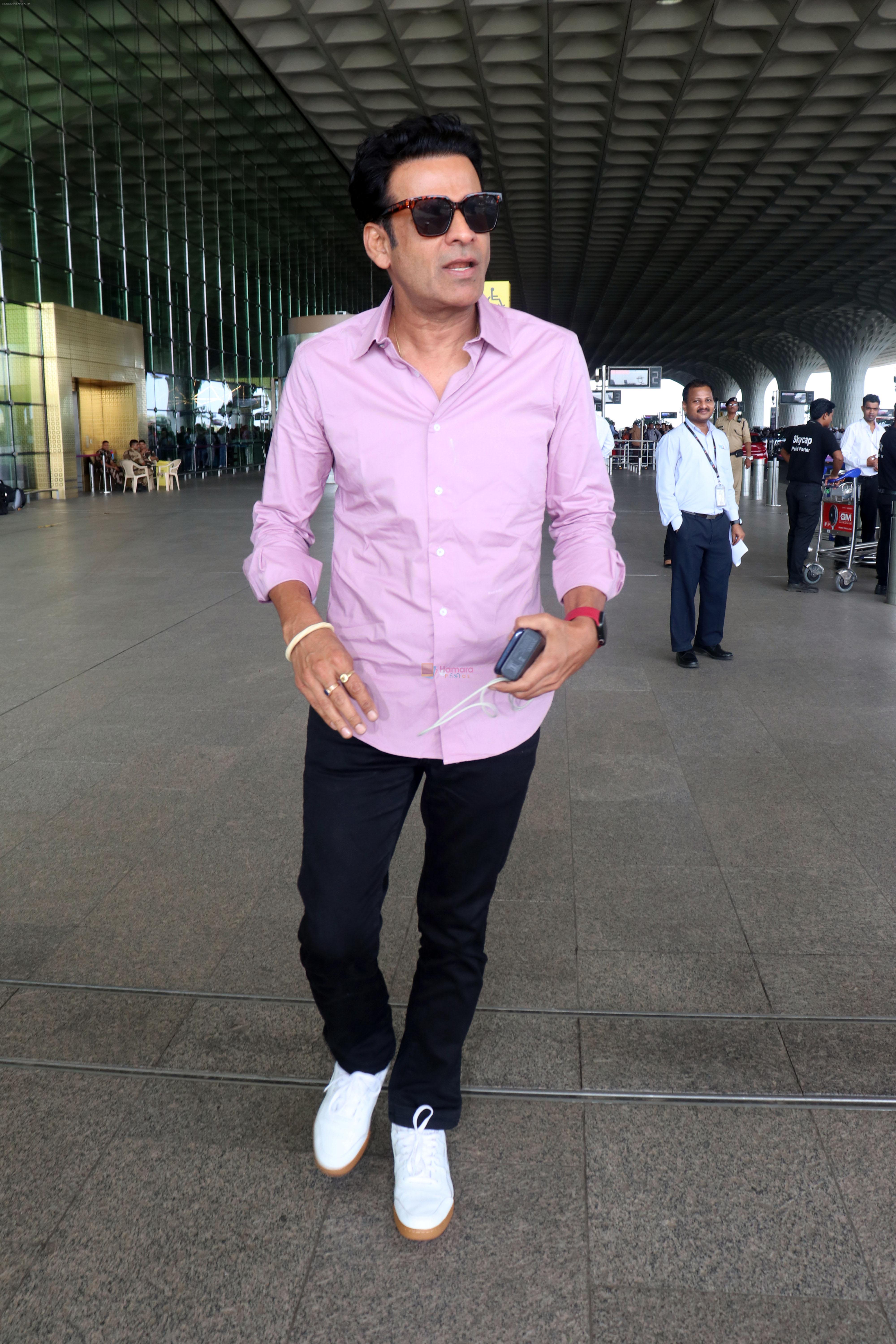 Manoj Bajpayee dressed in light blue shirt and black pant