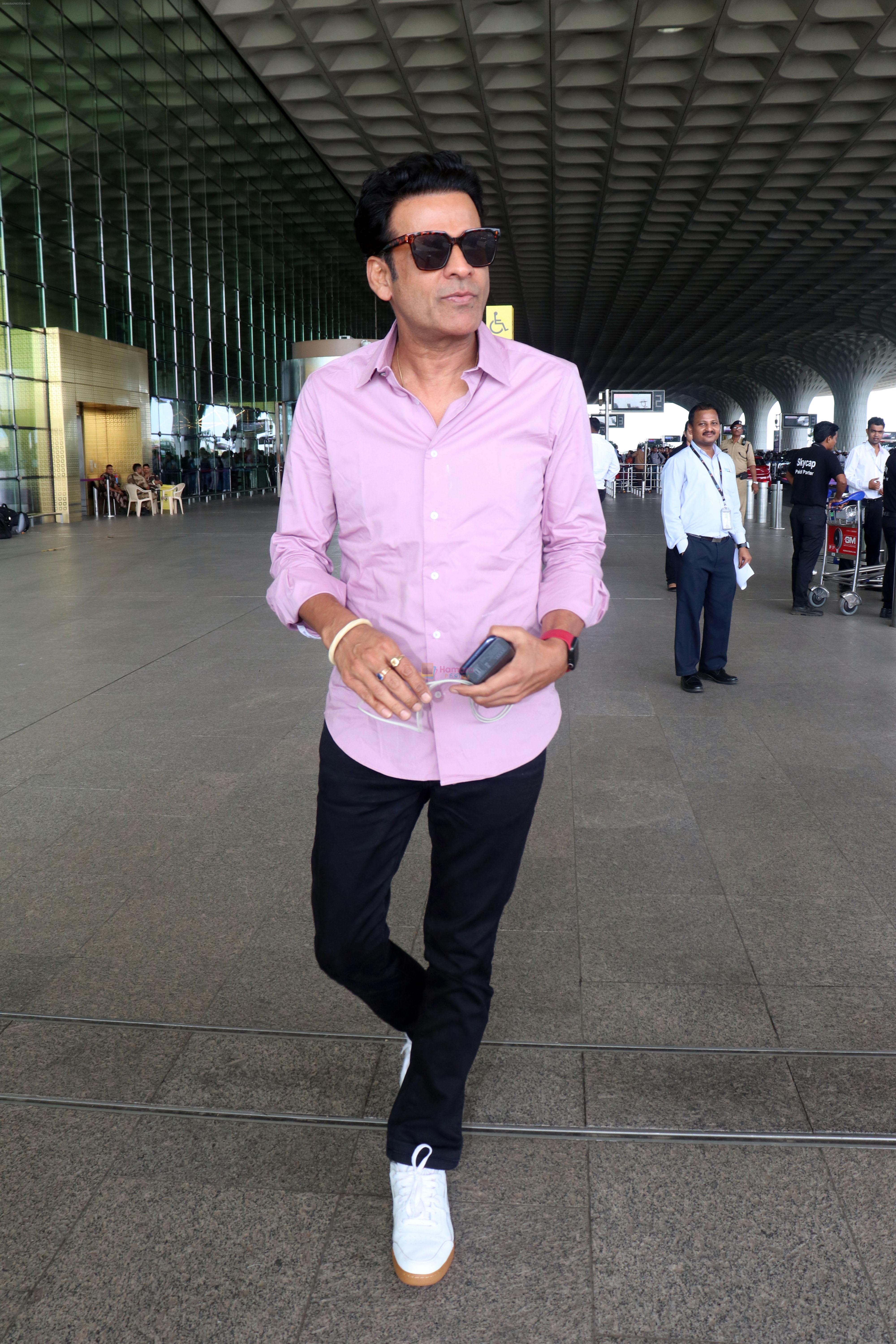 Manoj Bajpayee dressed in light blue shirt and black pant