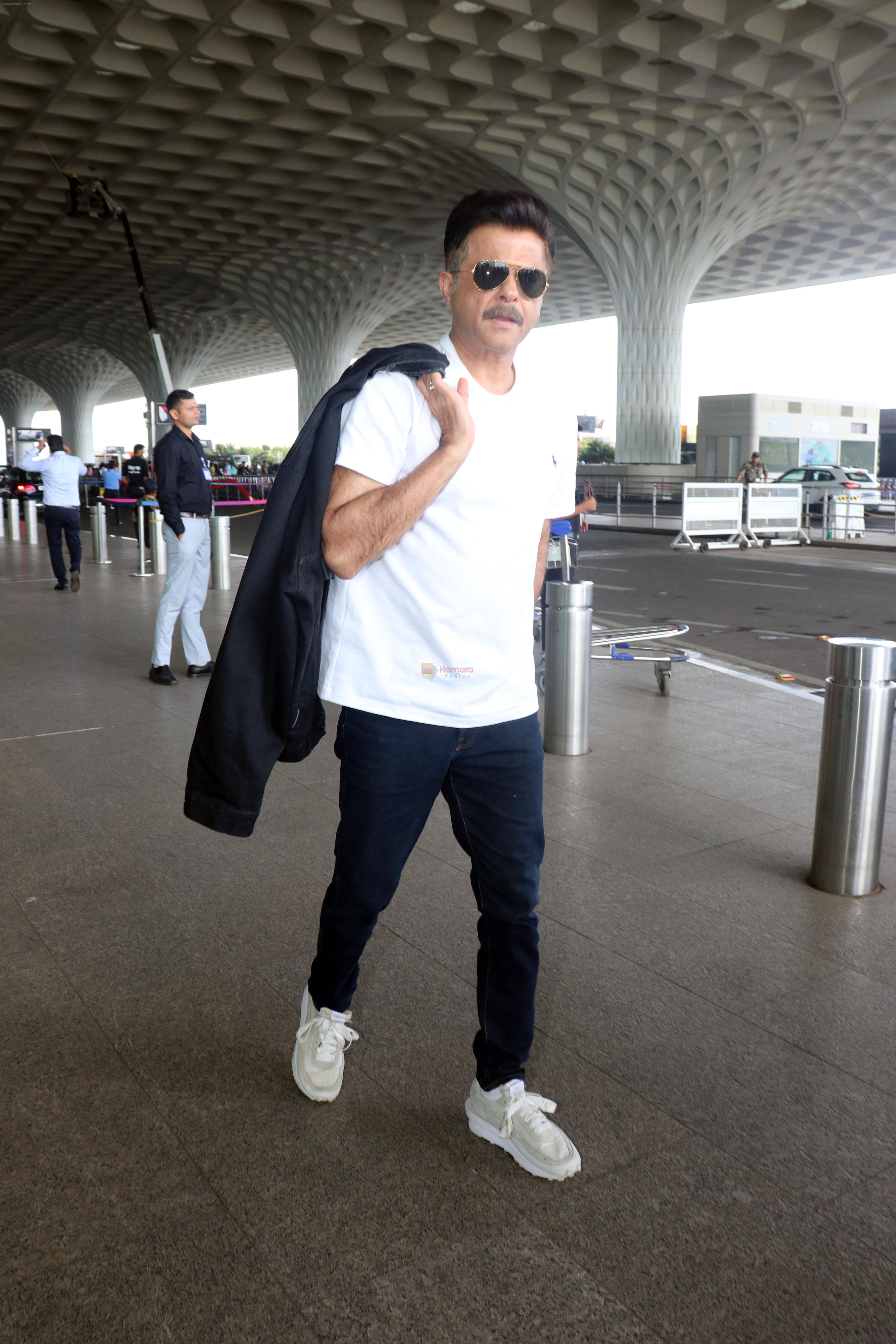 Anil Kapoor in a white T-Shirt and Blue Jeans at the airport on 13 Jun 2023