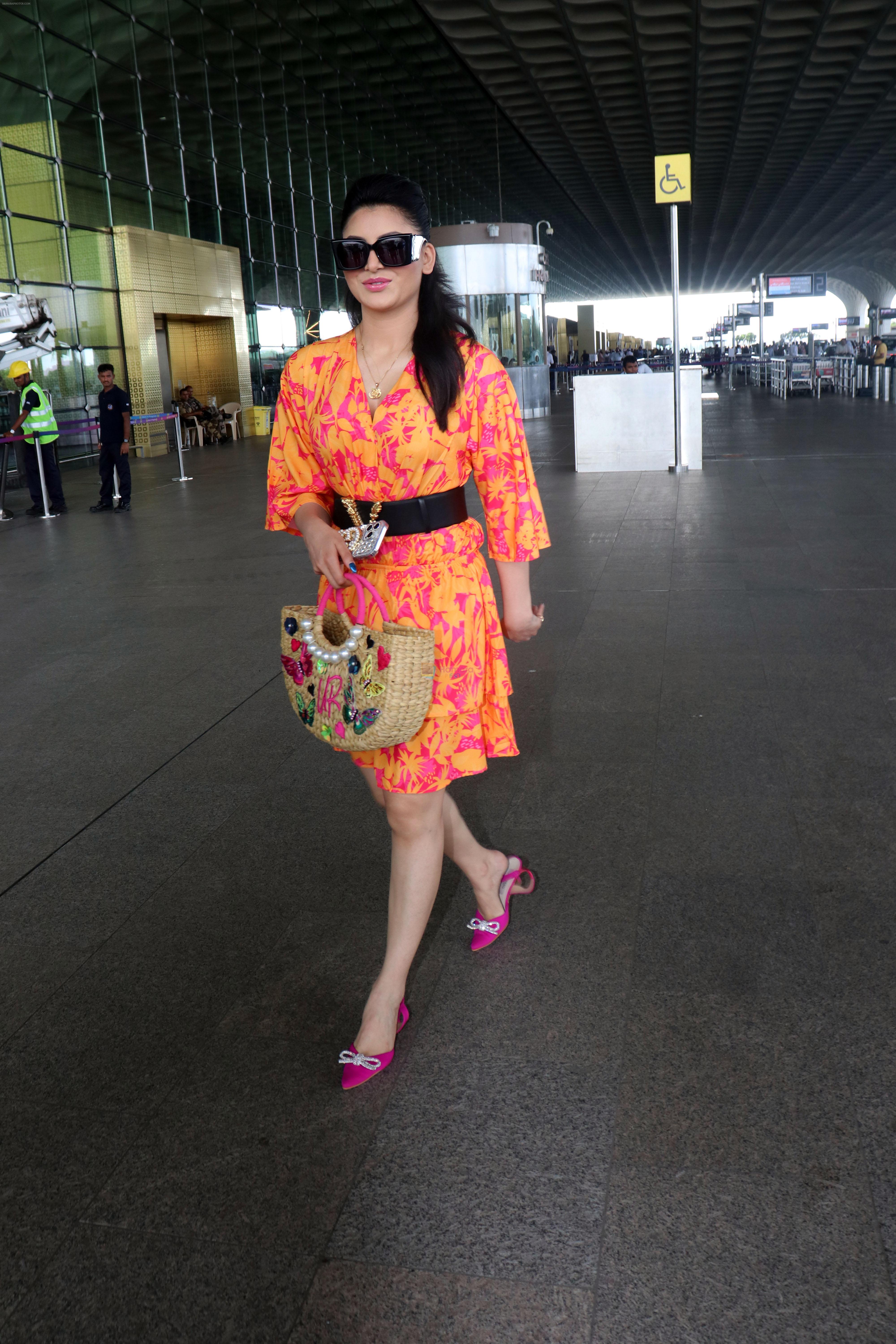 Urvashi Rautela dressed in a pink and orange floral dress spotted at airport on 14 Jun 2023