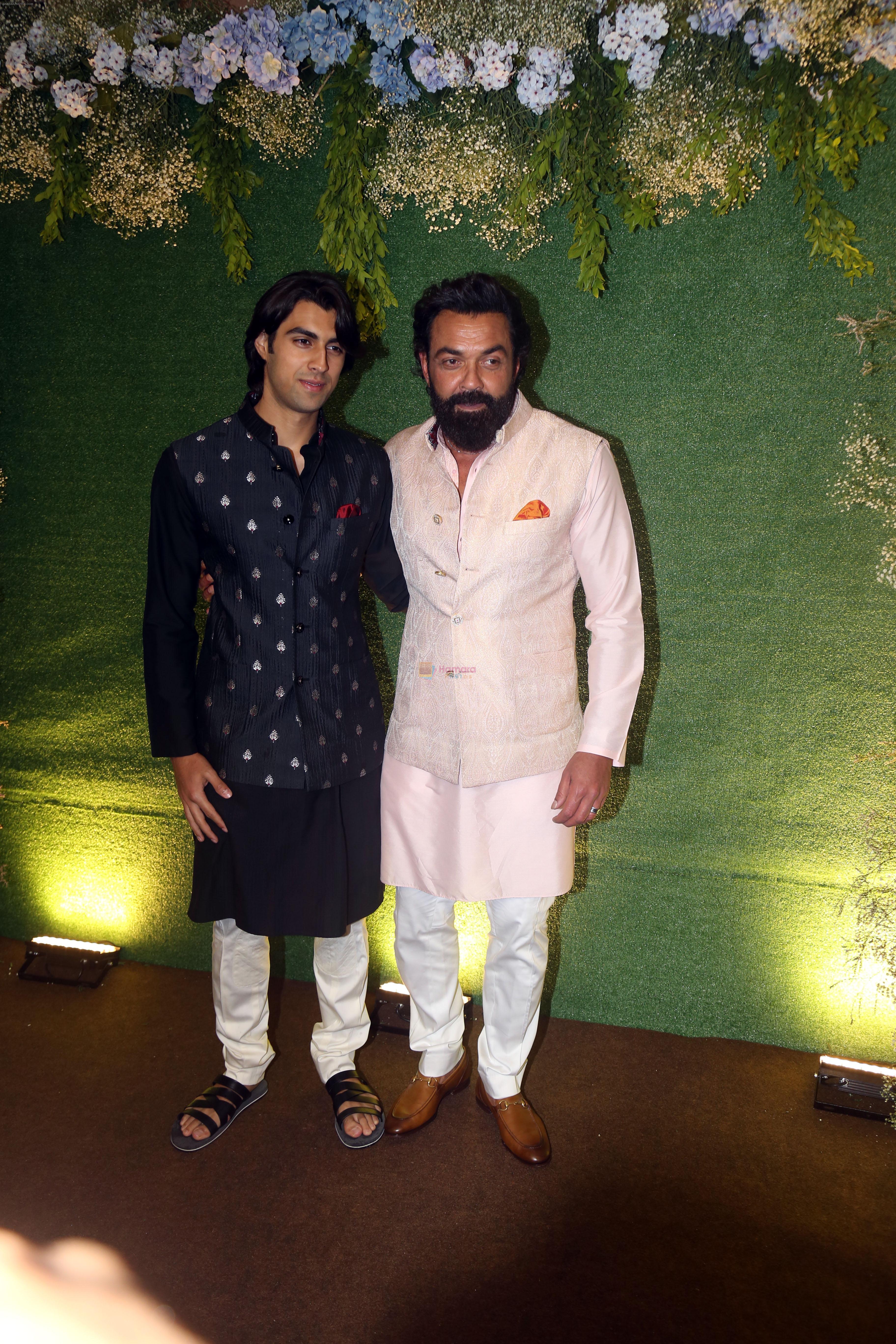 Bobby Deol with son Aryaman Deol pose for camera after the sangeet function on 16 Jun 2023