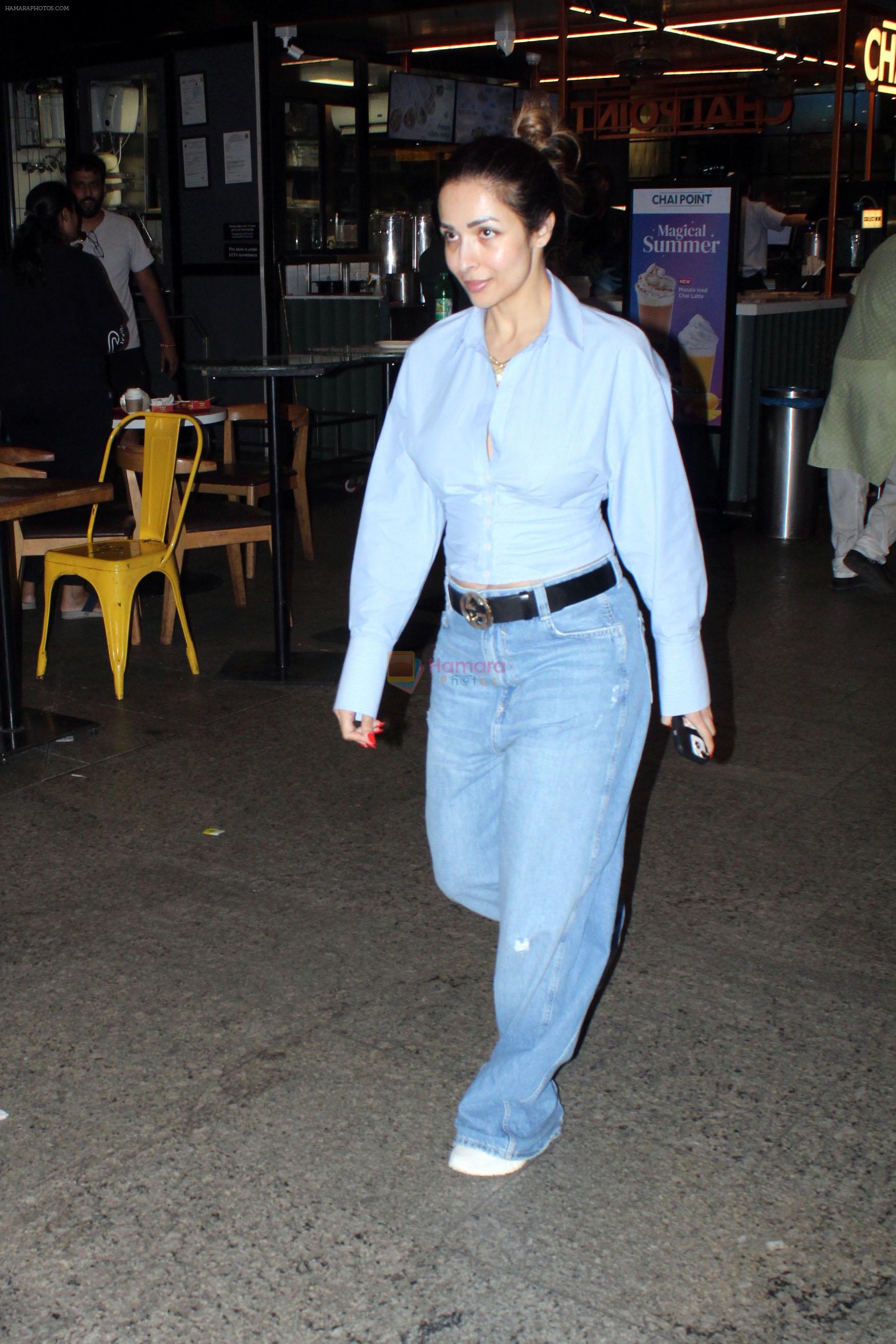 Malaika Arora dressed in blue shirt and pant seen at the airport on 16 Jun 2023