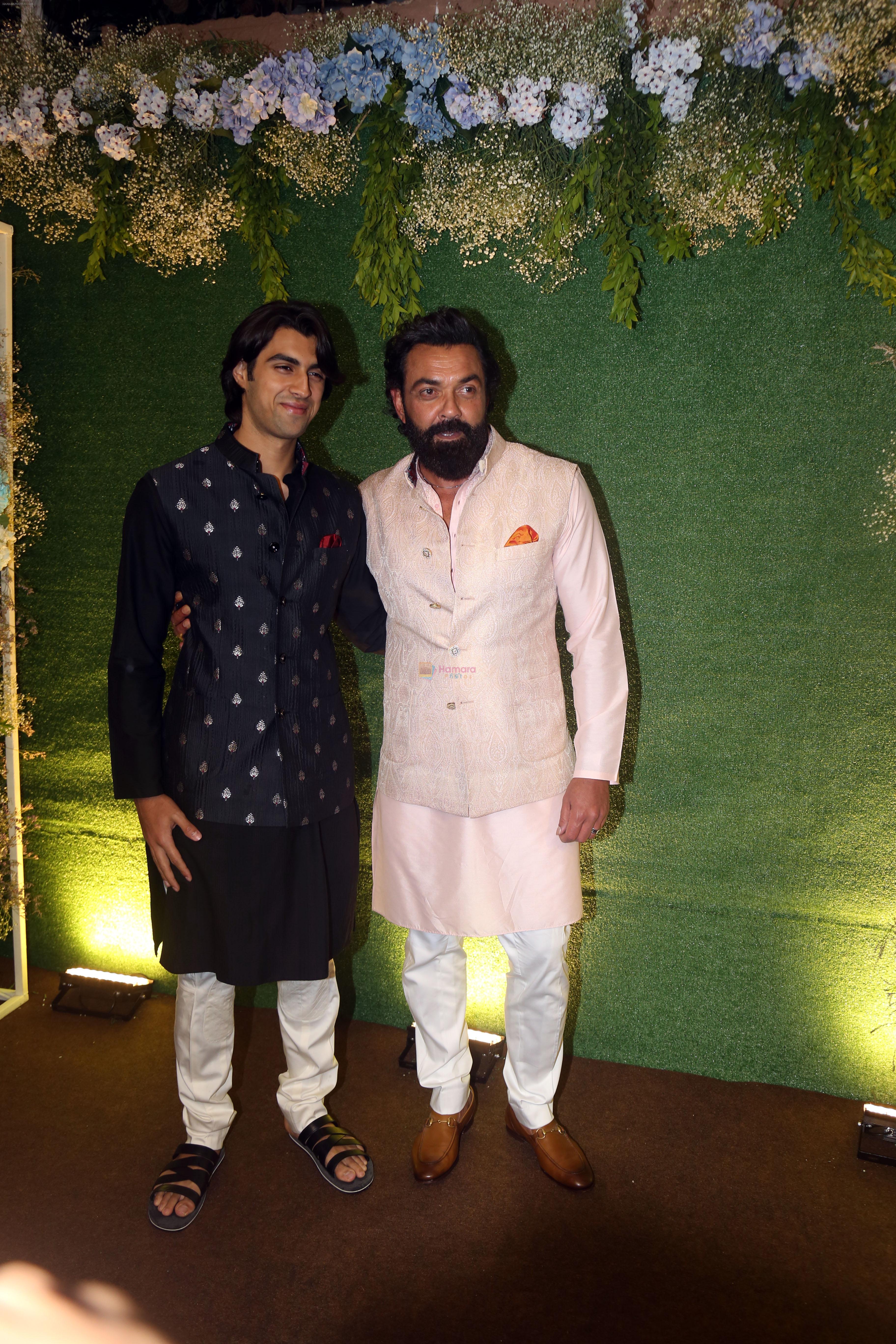 Bobby Deol with son Aryaman Deol pose for camera after the sangeet function on 16 Jun 2023