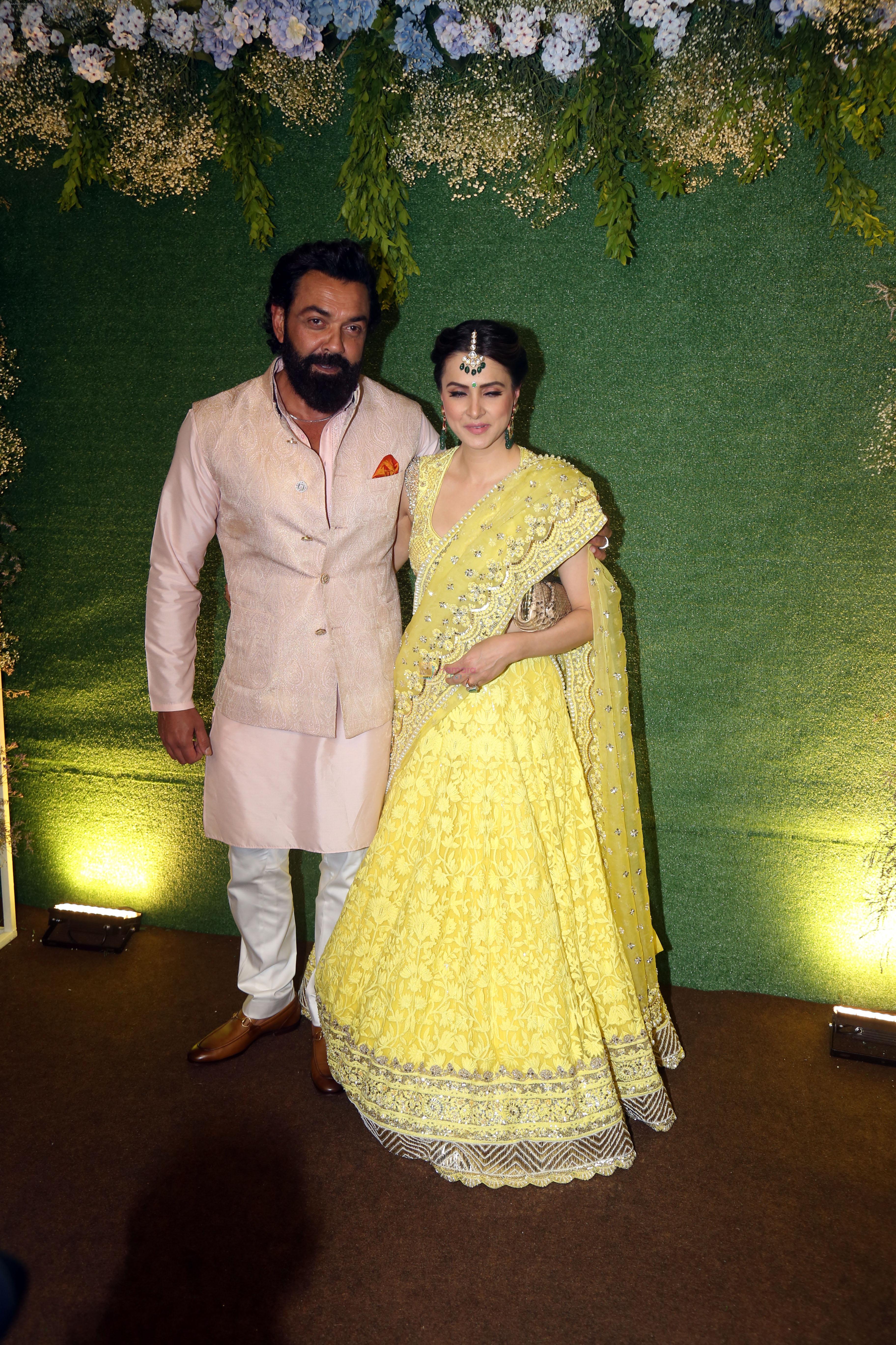 Bobby Deol with spouse Tanya Deol pose for camera after the sangeet function on 16 Jun 2023