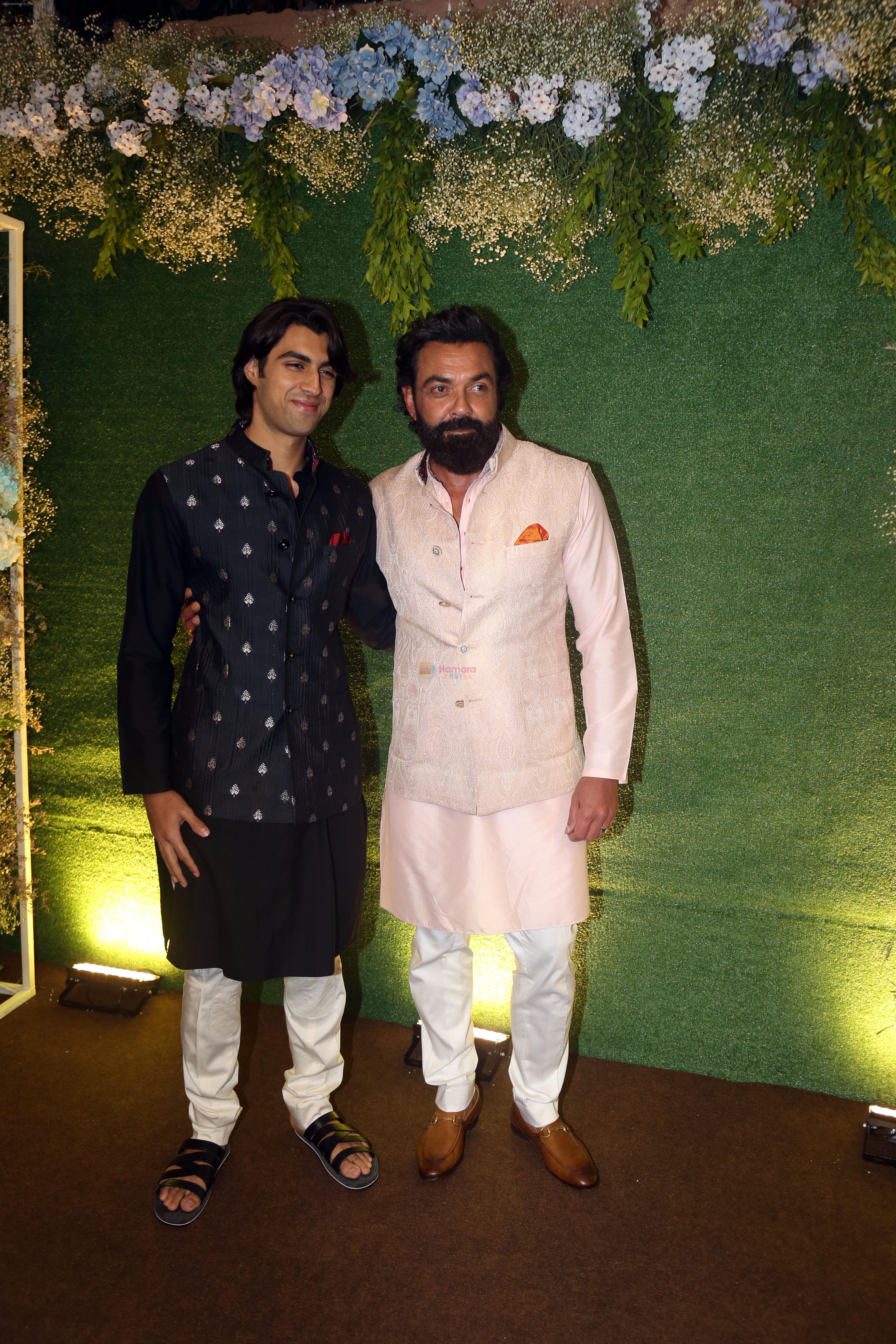 Bobby Deol with son Aryaman Deol pose for camera after the sangeet function on 16 Jun 2023