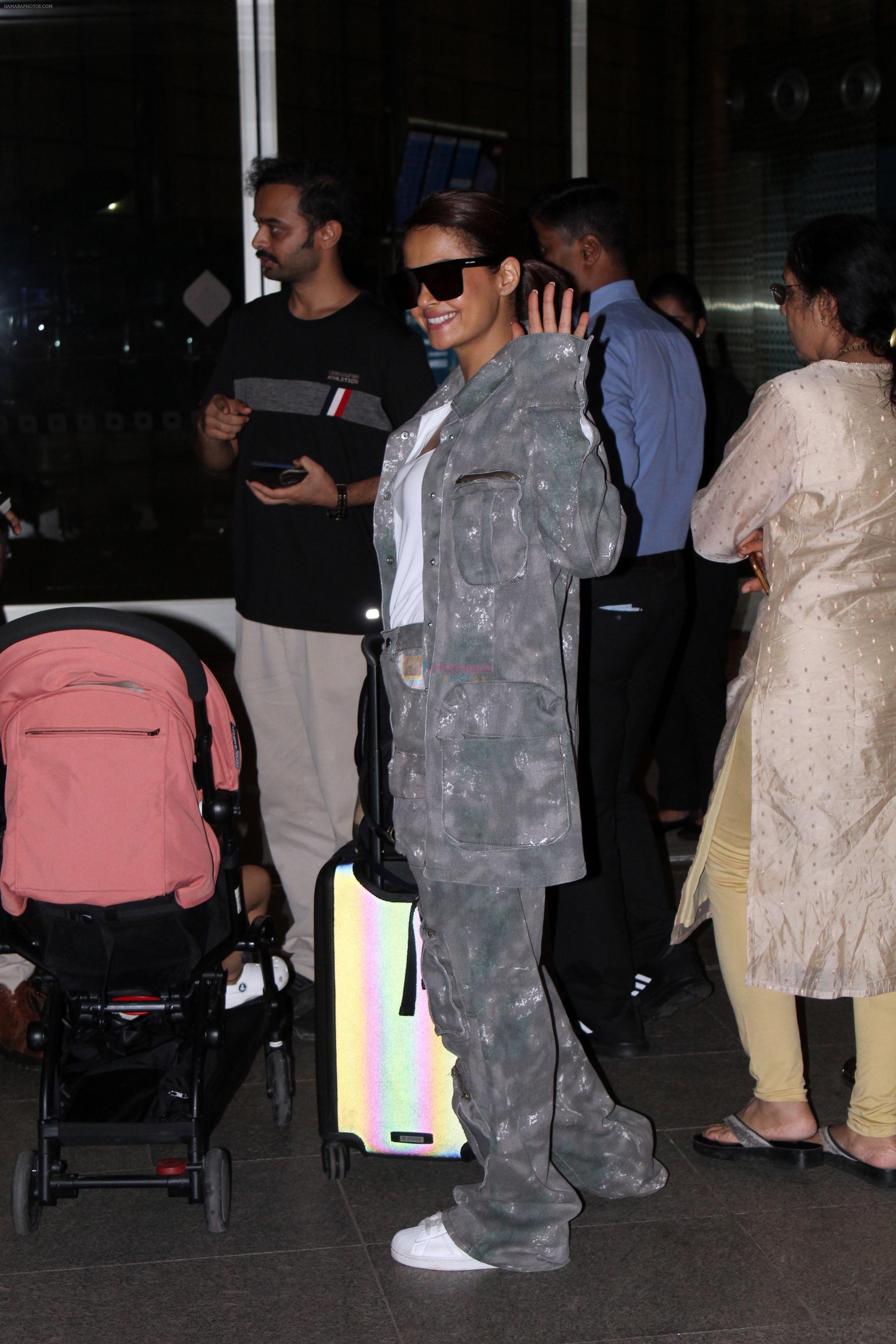 Surveen Chawla at the airport dressed in a light gray camouflage jacket and pant at 11PM on 17 Jun 2023
