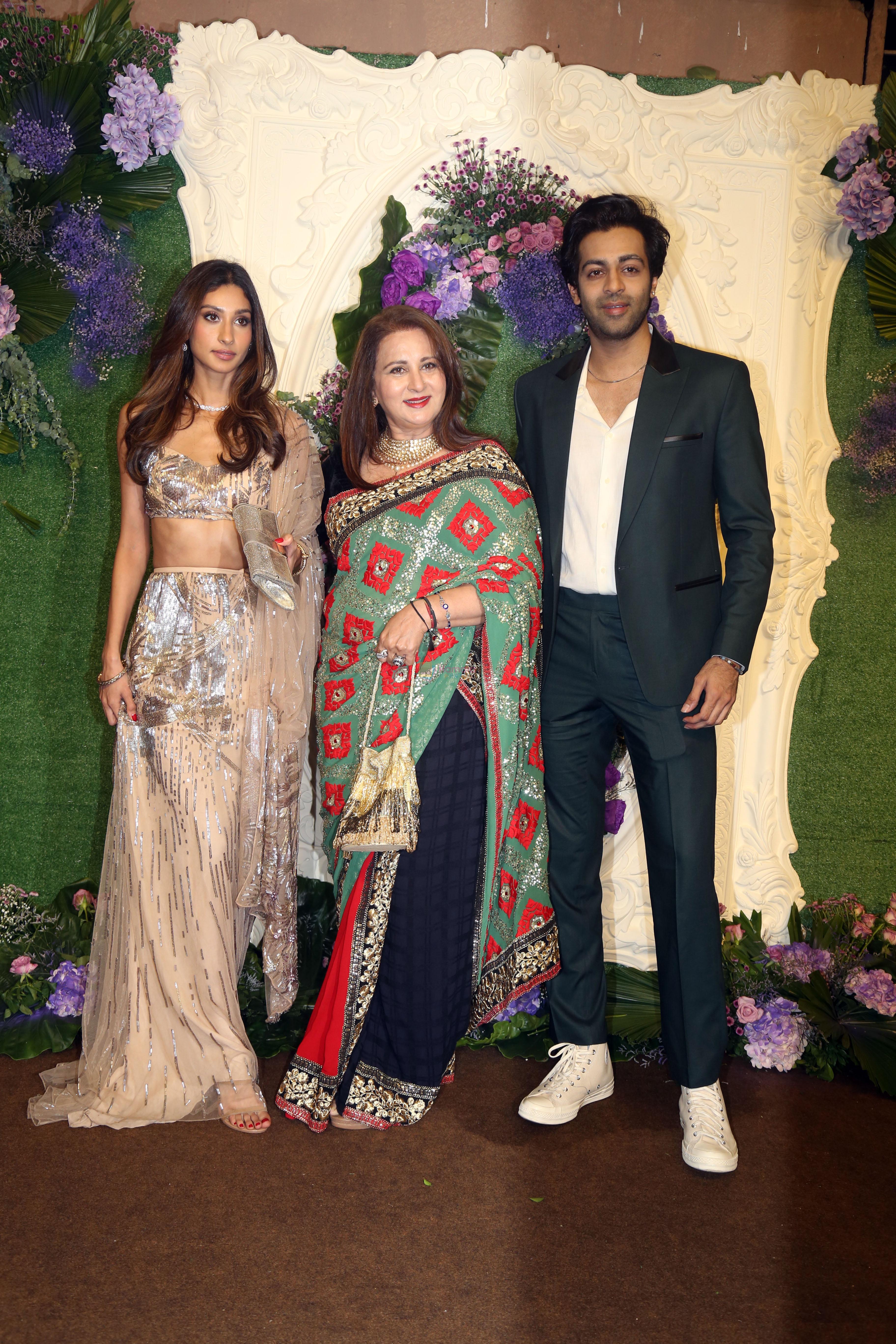 Poonam Dhillon with kids Paloma Thakeria and Anmol Thakeria Pose for media at the reception of Karan Deol and Drisha Acharya on 18 Jun 2023