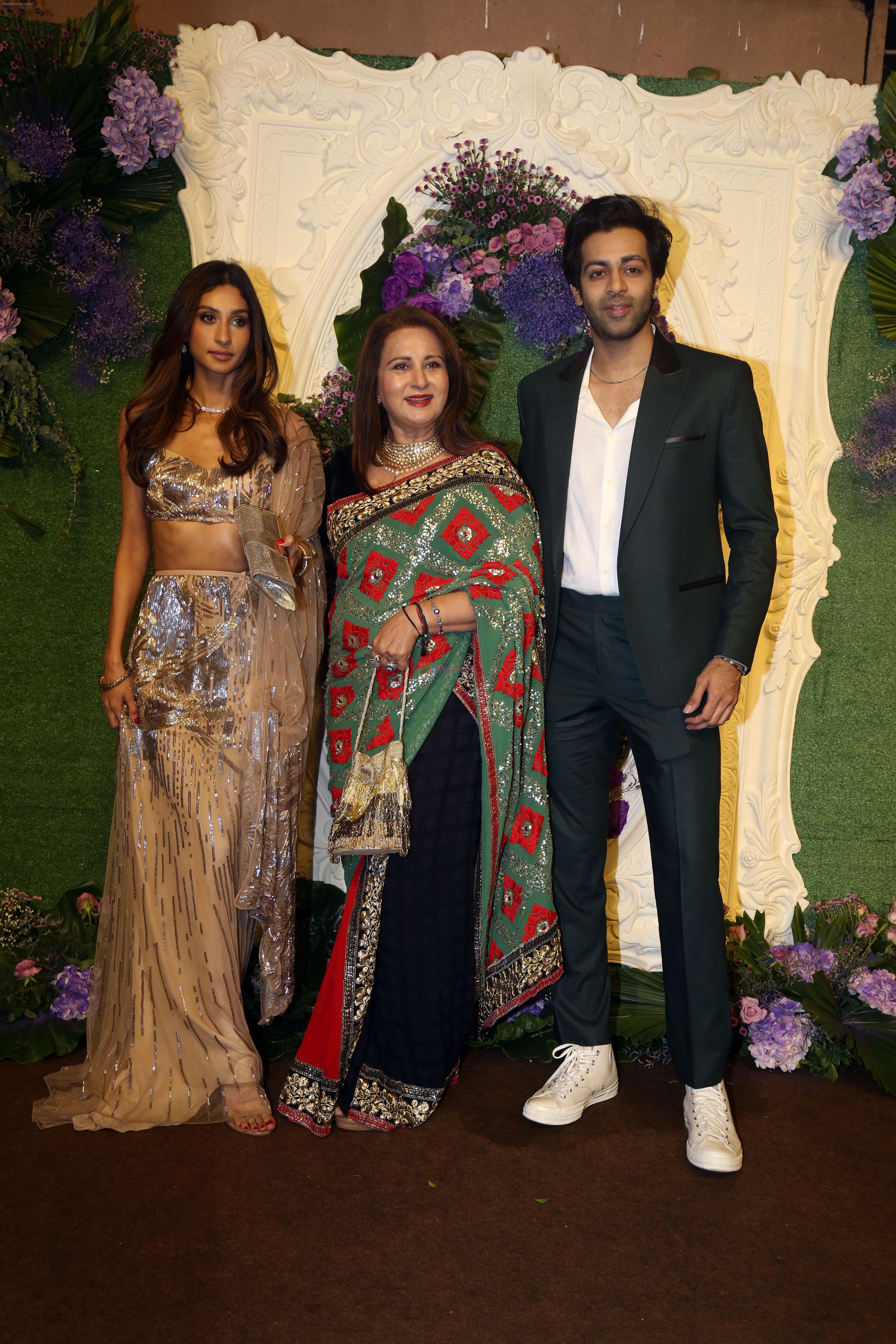 Poonam Dhillon with kids Paloma Thakeria and Anmol Thakeria Pose for media at the reception of Karan Deol and Drisha Acharya on 18 Jun 2023