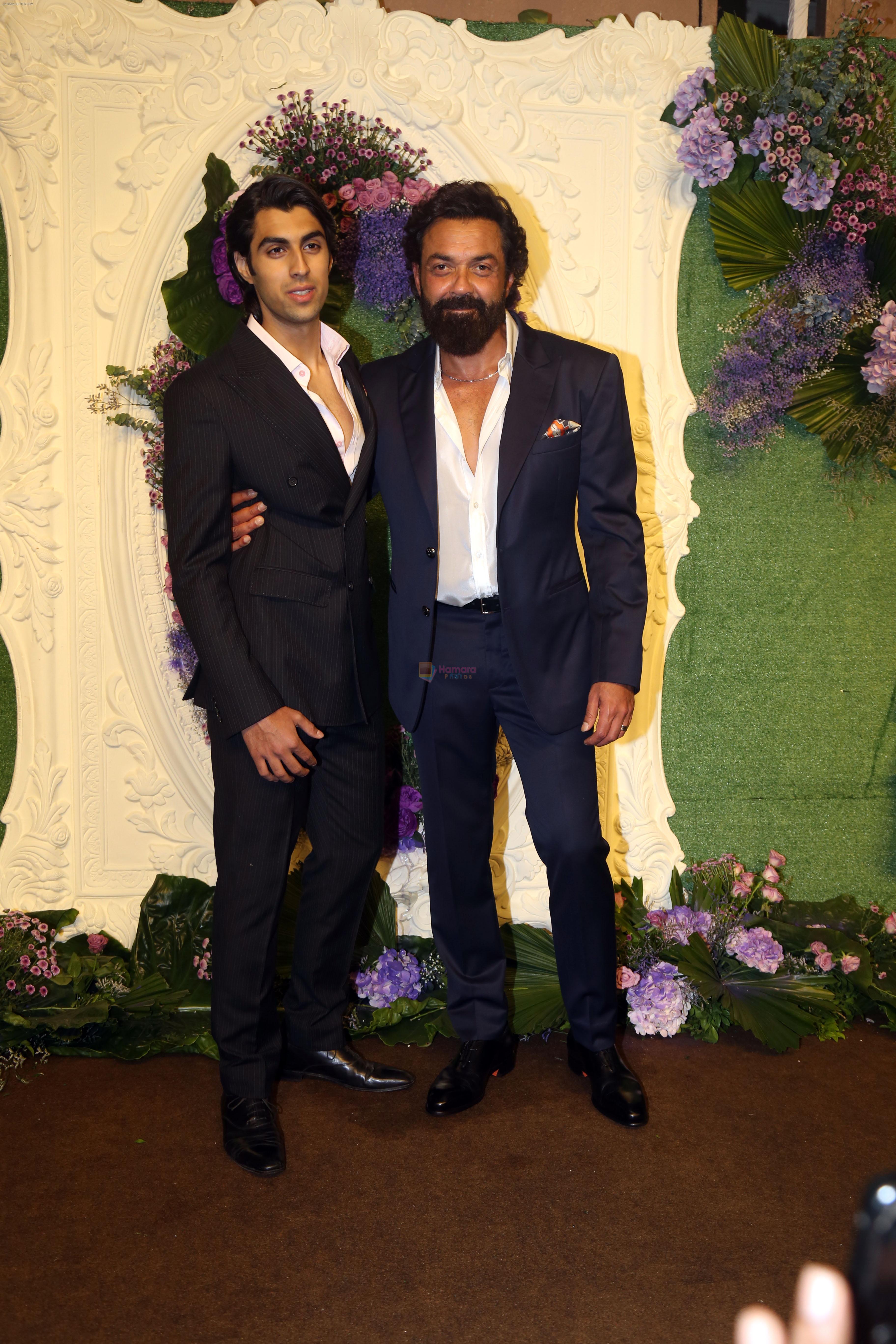 Bobby Deol with son Aryaman Pose for media at the reception of Karan Deol and Drisha Acharya on 18 Jun 2023