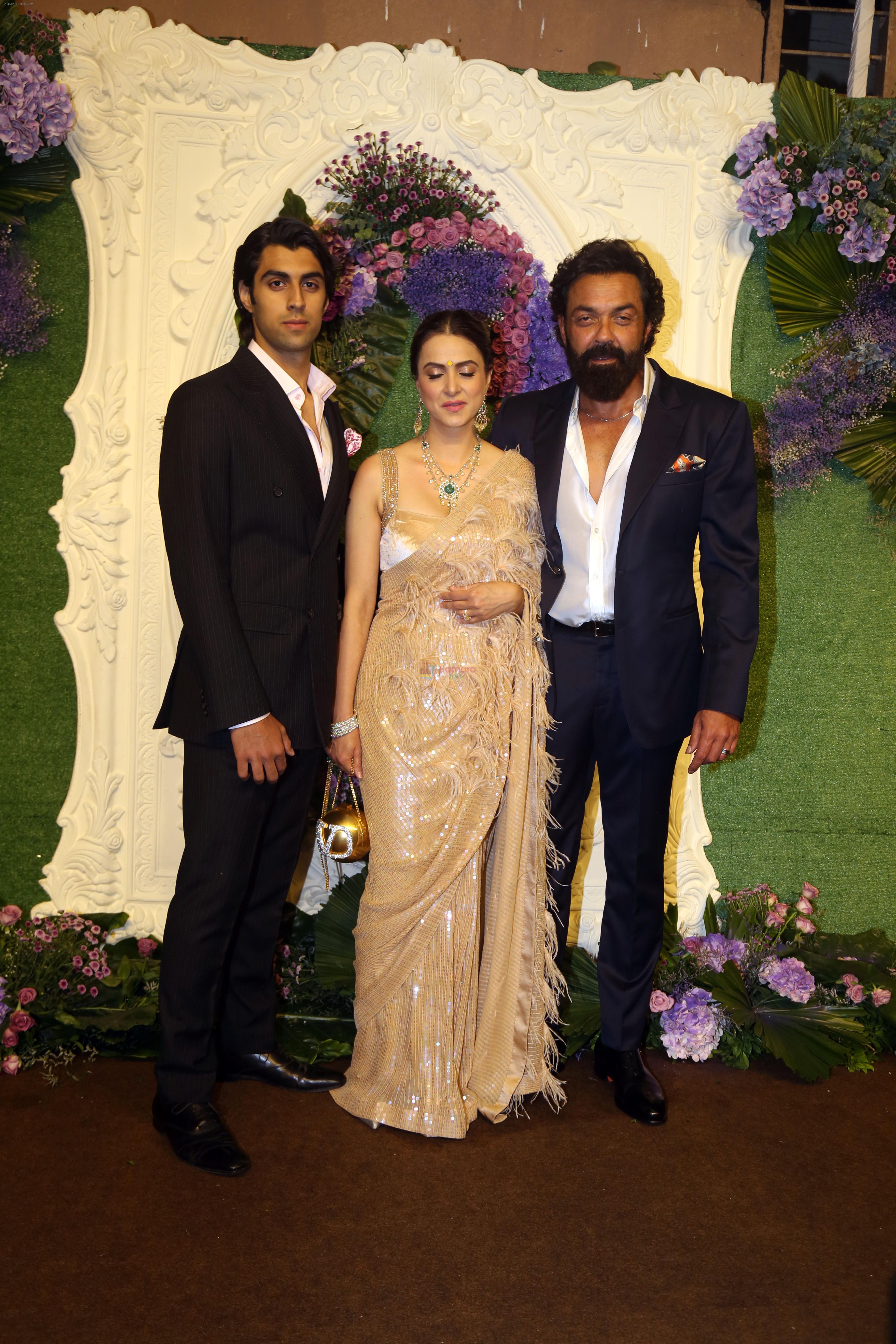 Bobby Deol with wife Tanya and son Aryaman Pose for media at the reception of Karan Deol and Drisha Acharya on 18 Jun 2023