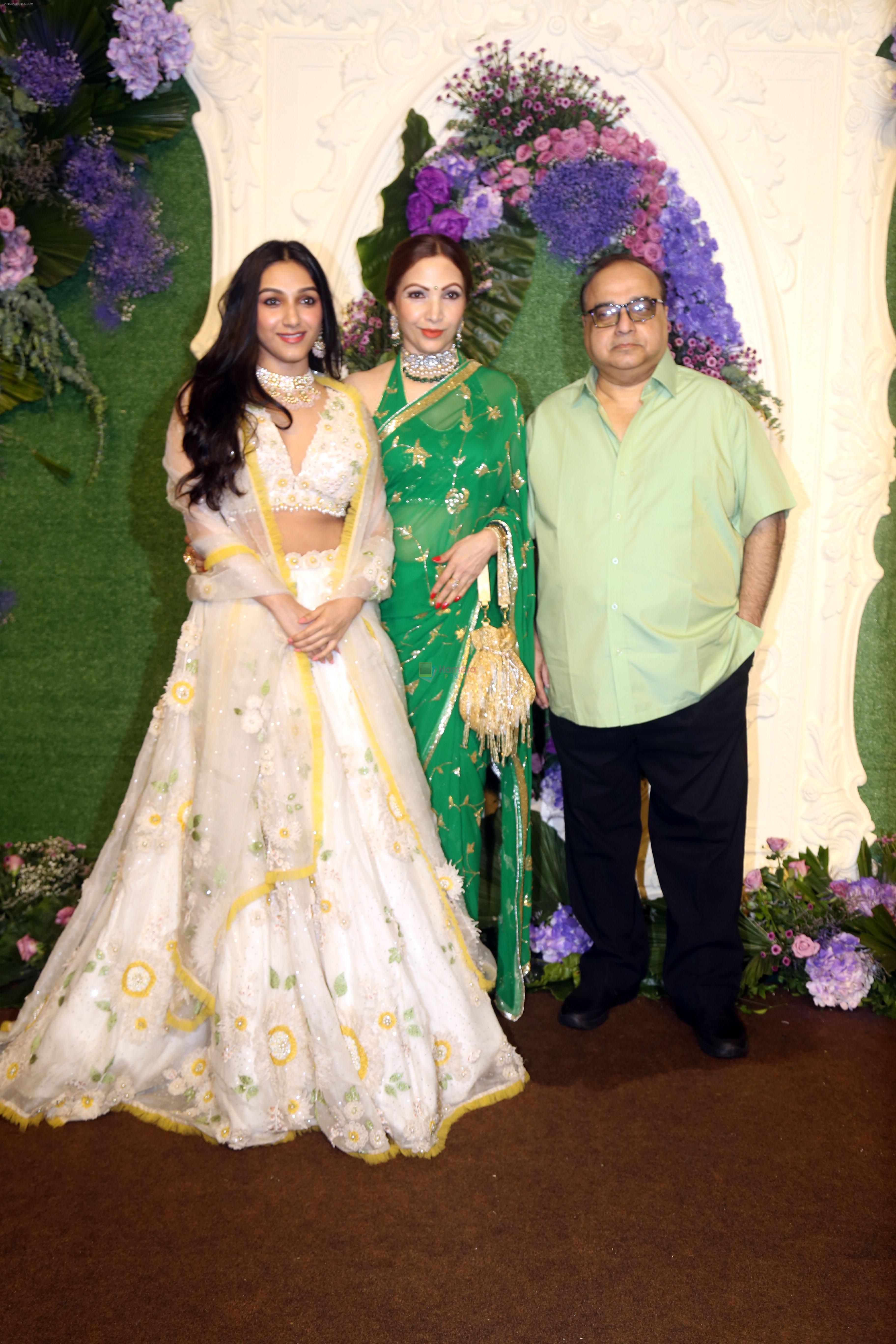 Rajkumar Santoshi with wife Manila and daughter Tanisha Pose for media at the reception of Karan Deol and Drisha Acharya on 18 Jun 2023