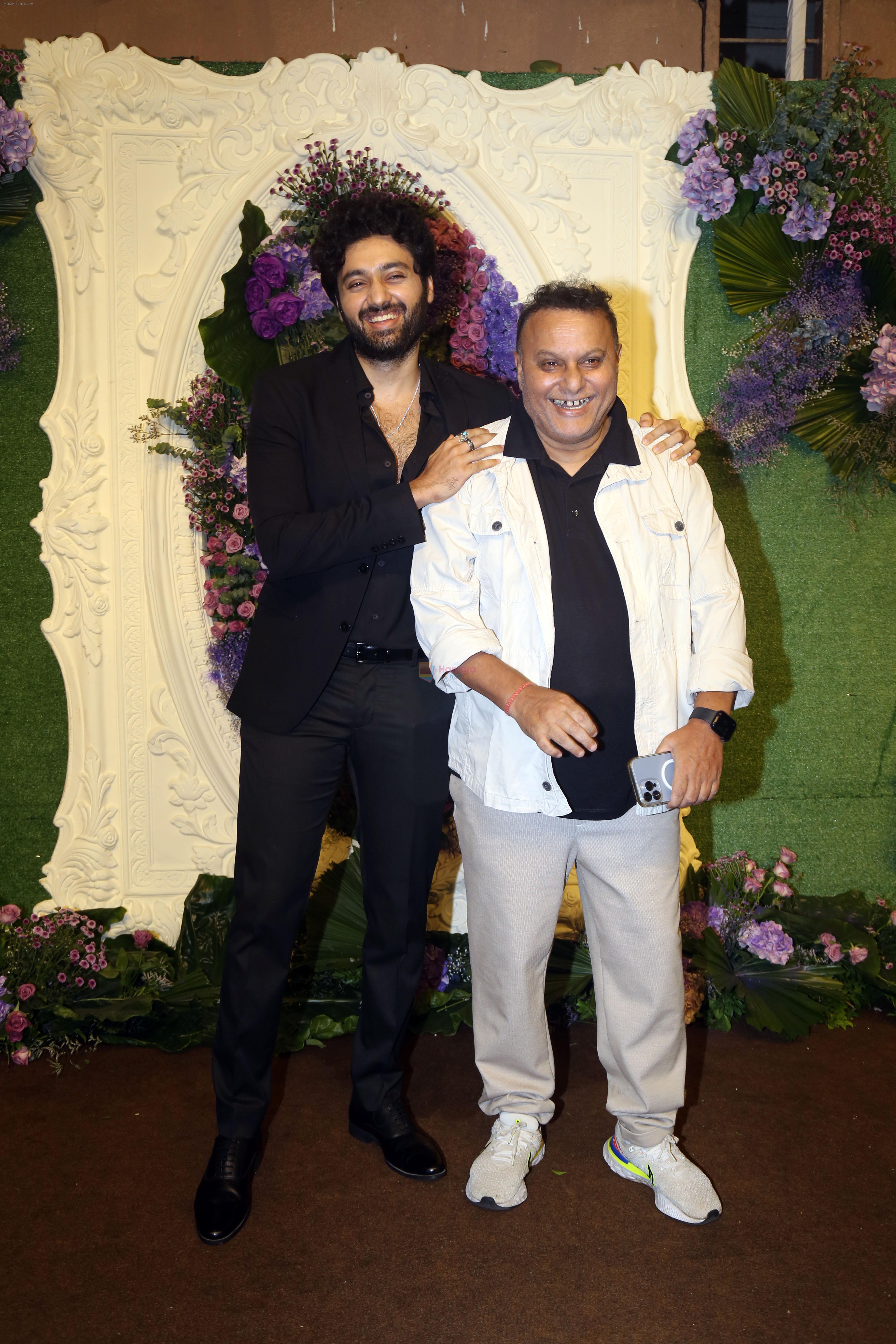 Anil Sharma with son Utkarsh Pose for media at the reception of Karan Deol and Drisha Acharya on 18 Jun 2023