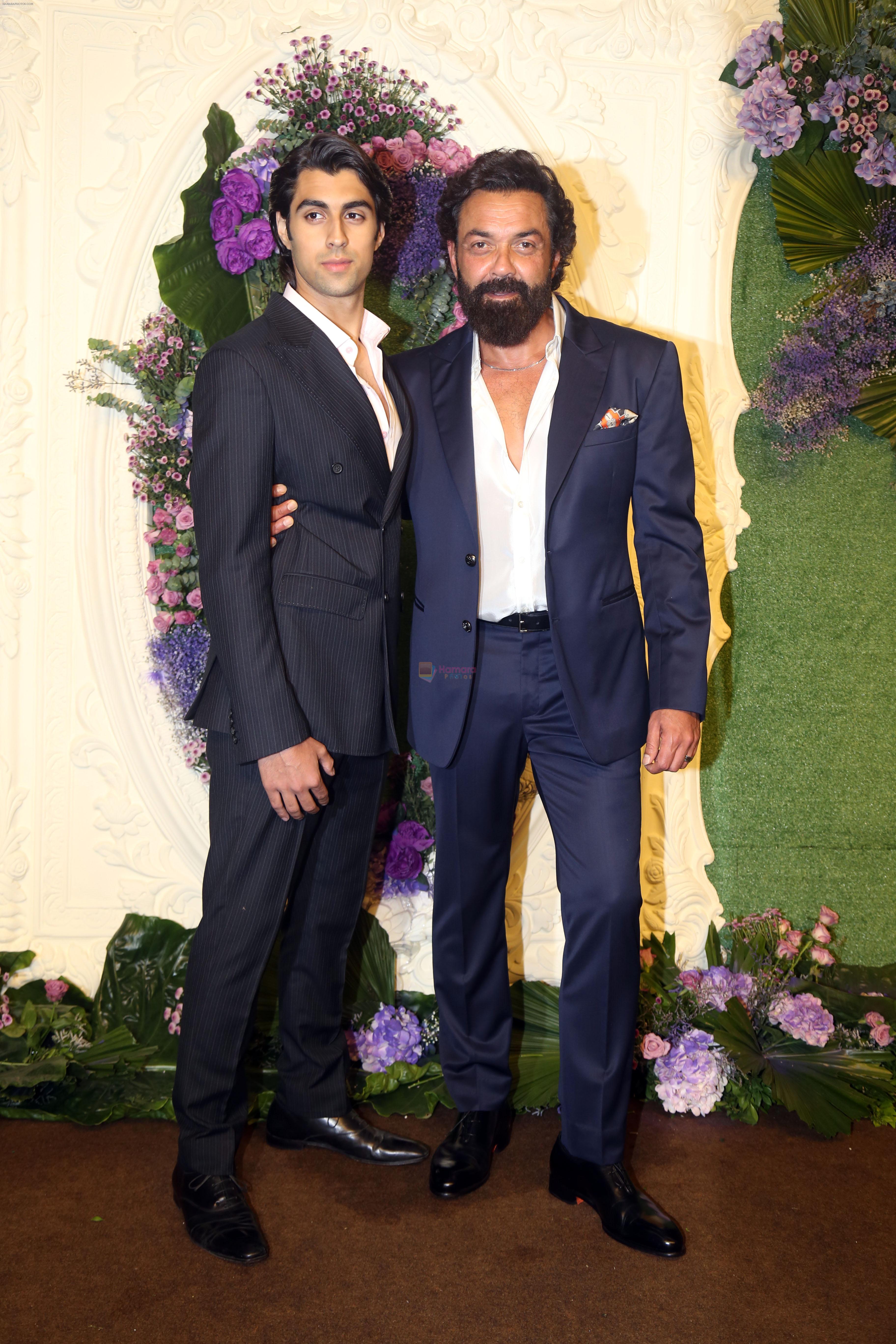 Bobby Deol with son Aryaman Pose for media at the reception of Karan Deol and Drisha Acharya on 18 Jun 2023