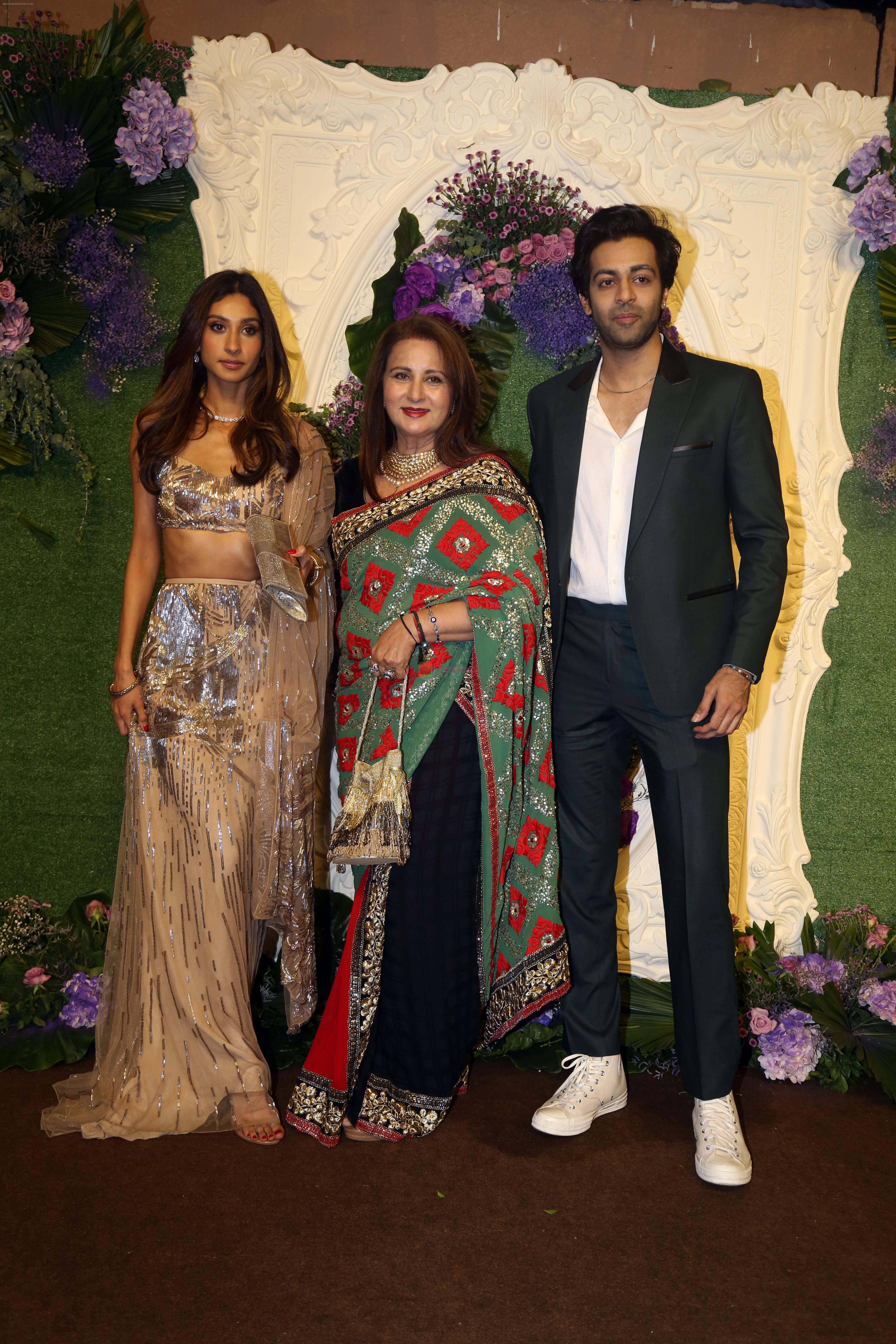 Poonam Dhillon with kids Paloma Thakeria and Anmol Thakeria Pose for media at the reception of Karan Deol and Drisha Acharya on 18 Jun 2023