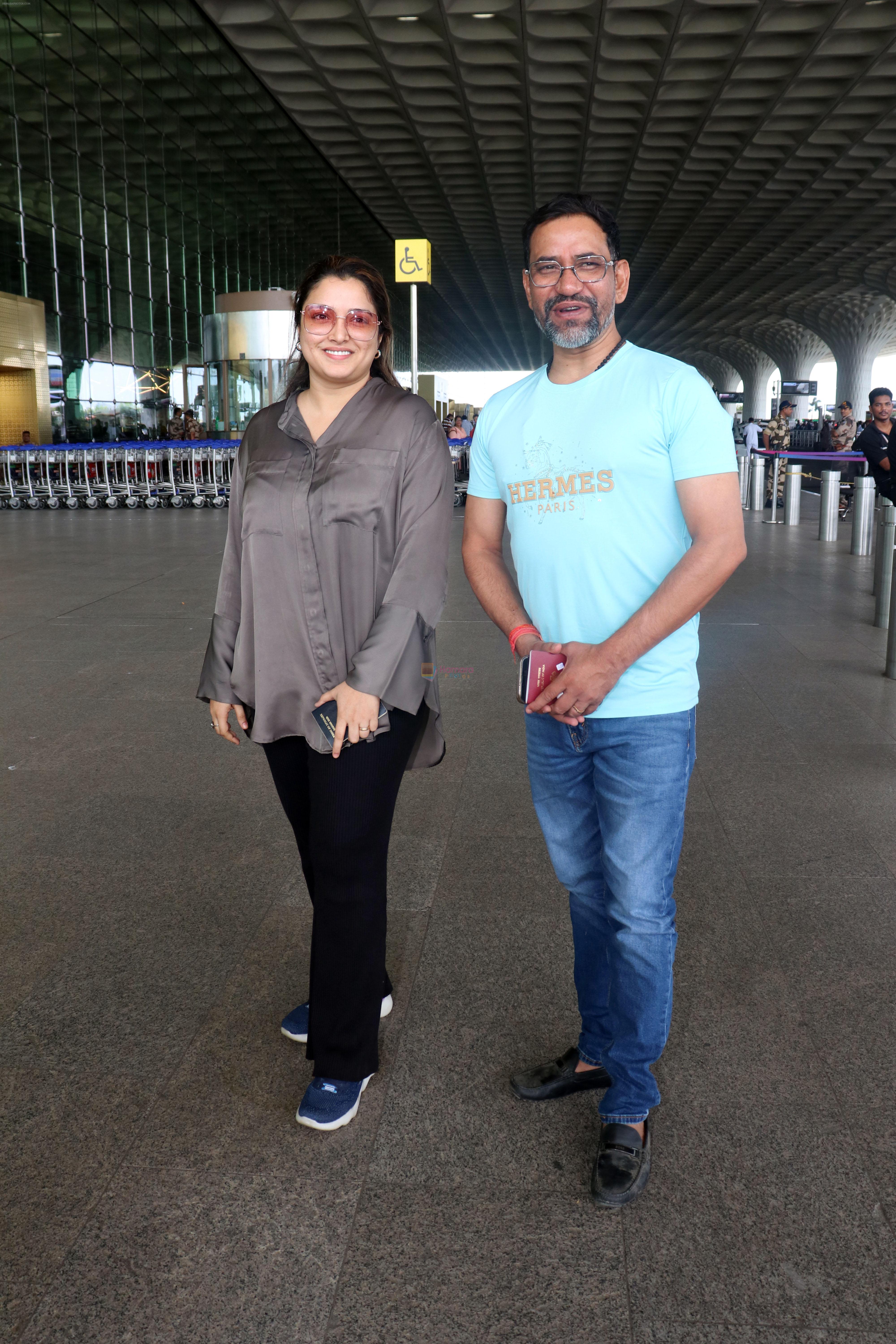 Dinesh Lal Yadav and Amrapali Dubey seen at the airport on 23 Jun 2023
