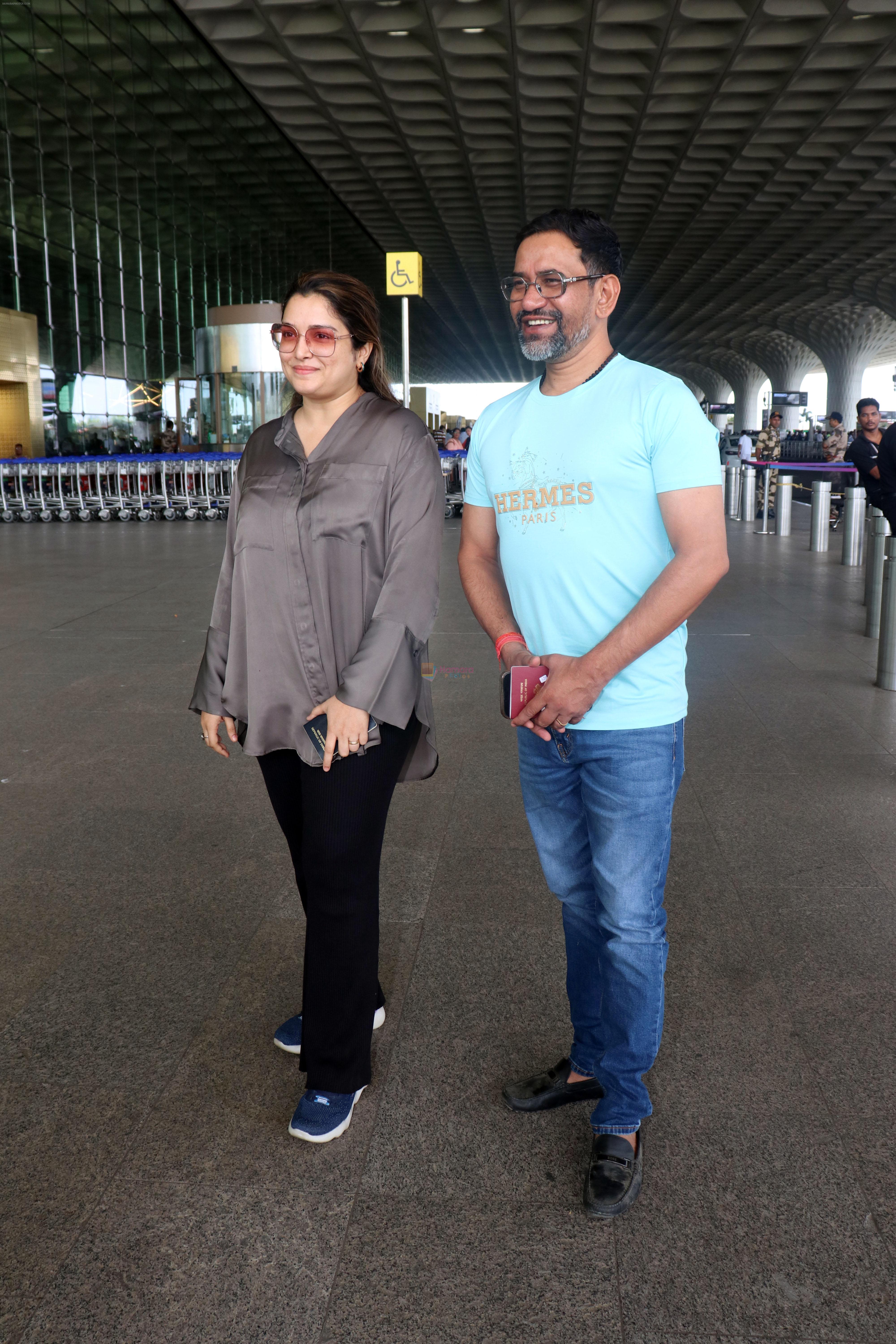 Dinesh Lal Yadav and Amrapali Dubey seen at the airport on 23 Jun 2023