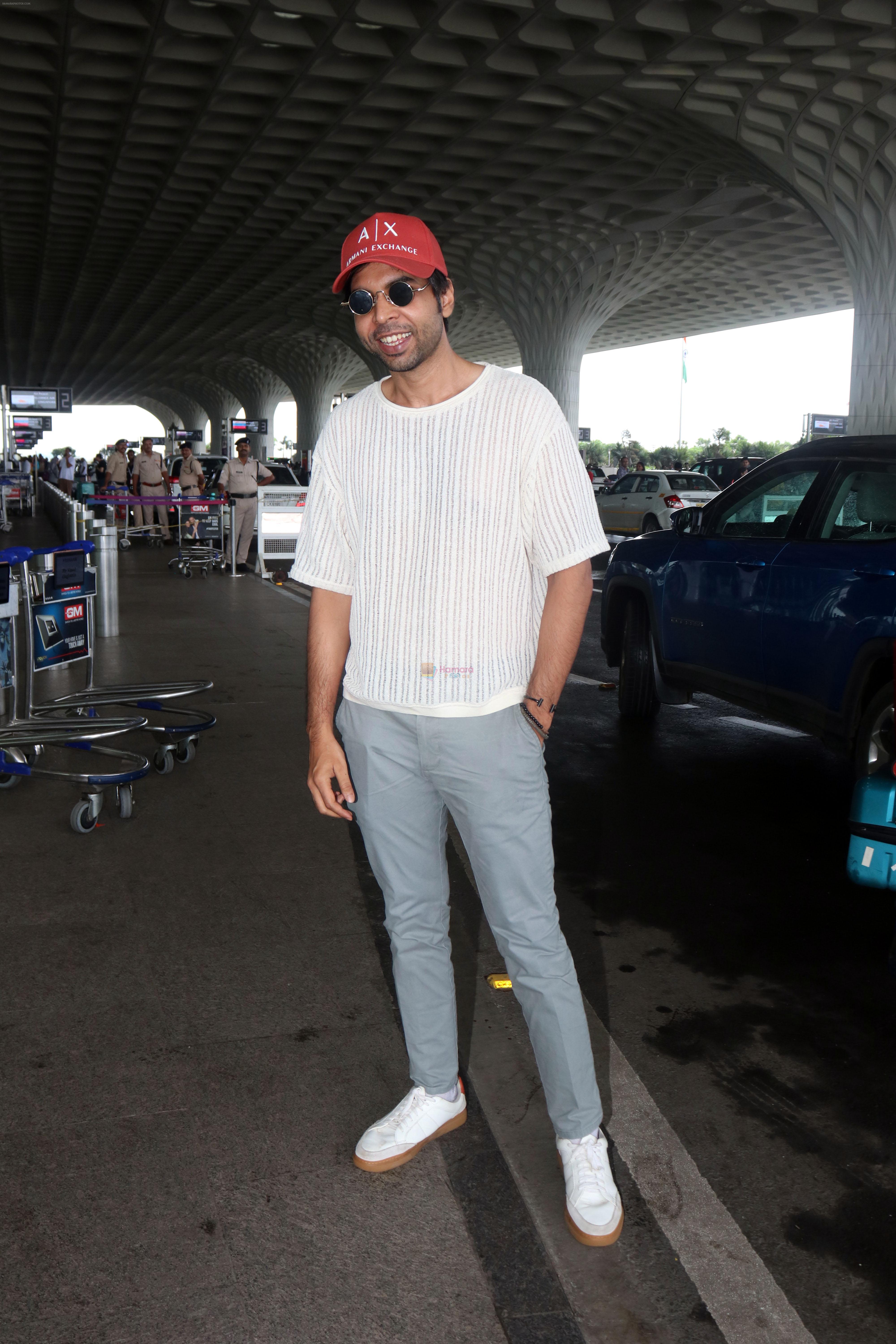 Abhishek Banerjee wearing Armani Exchange red cap seen at the airport on 1 July 2023
