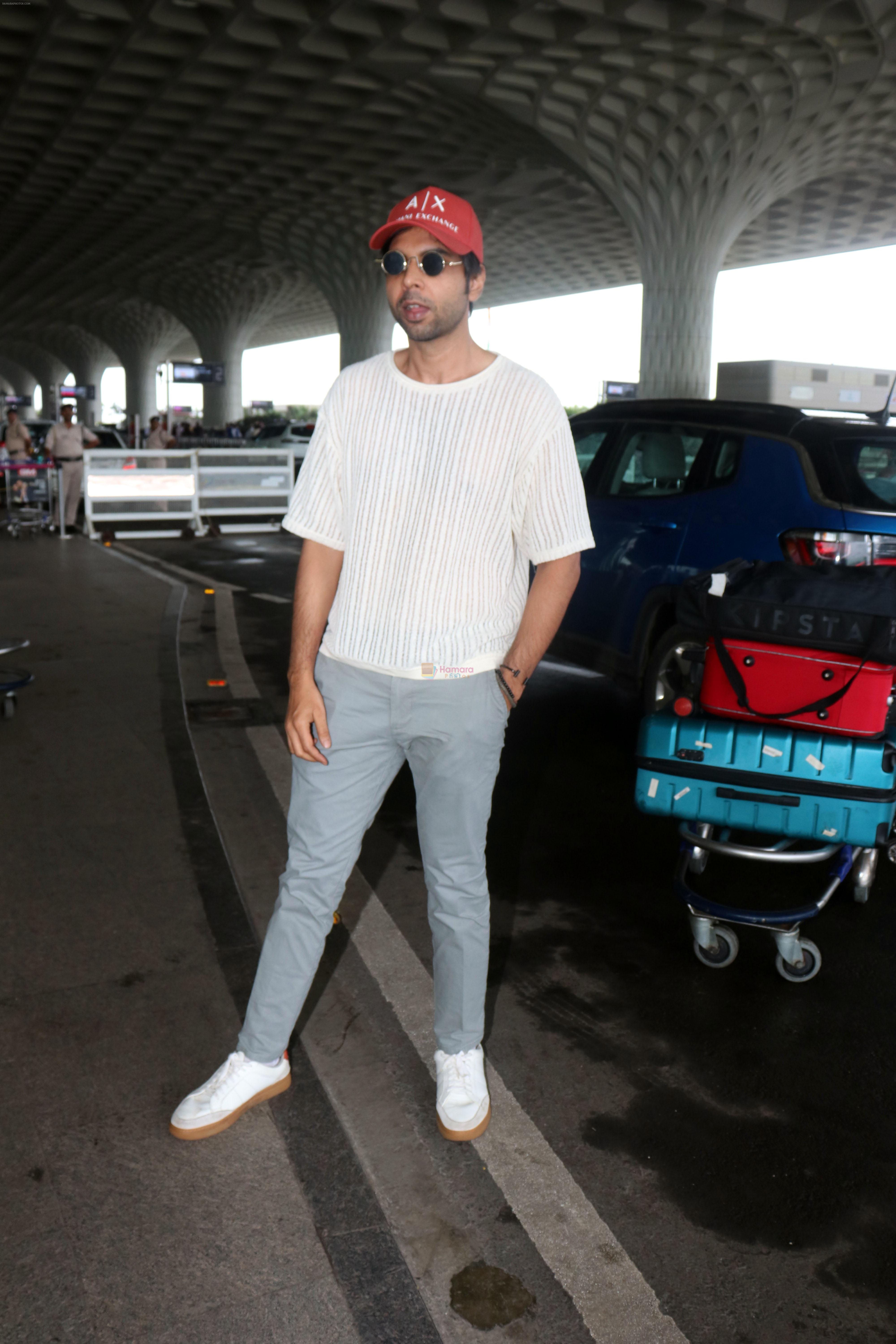 Abhishek Banerjee wearing Armani Exchange red cap seen at the airport on 1 July 2023