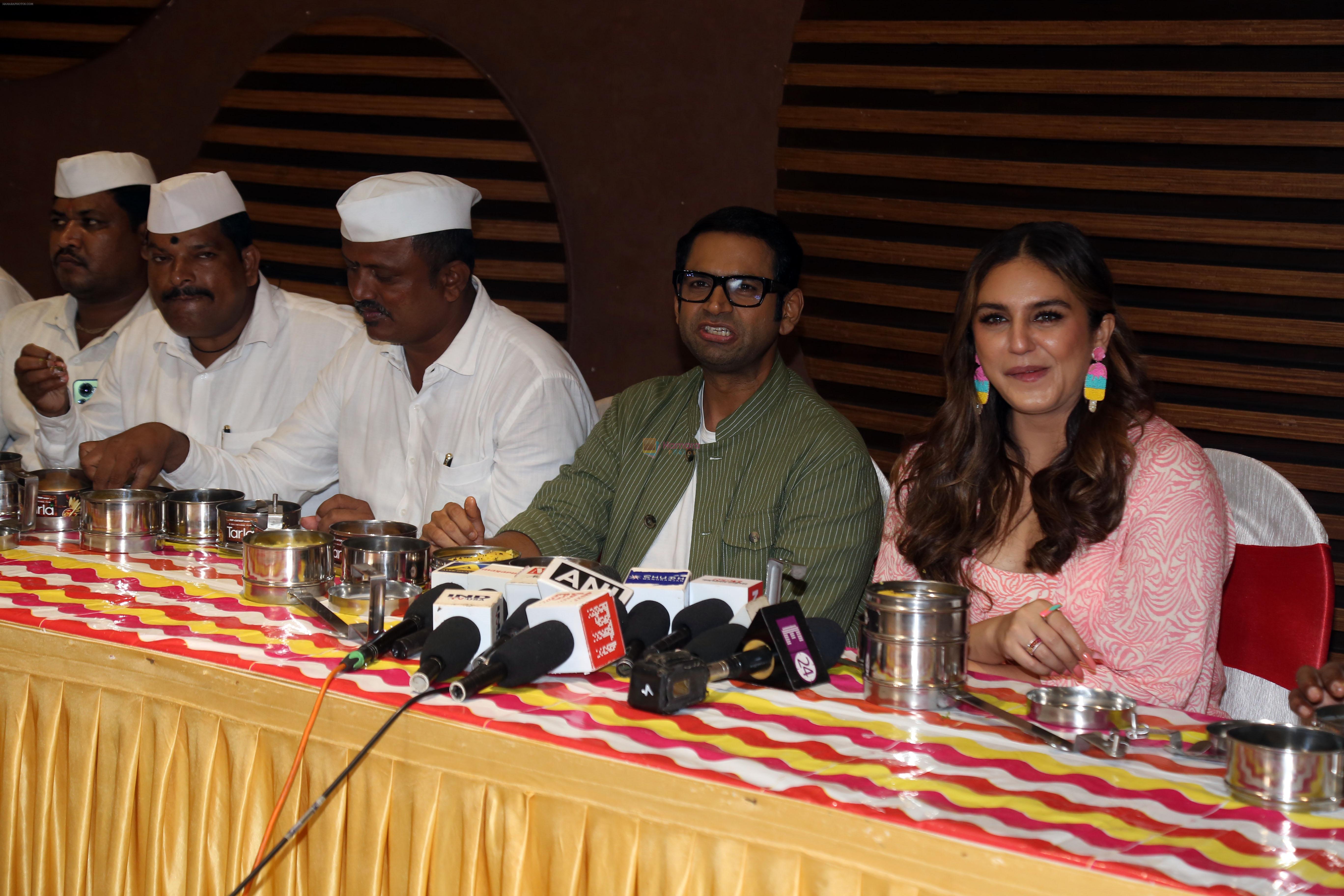 Huma Qureshi and Sharib Hashmi posing with Dabbawalas on the launch day of Film Tarla on 7 July 2023