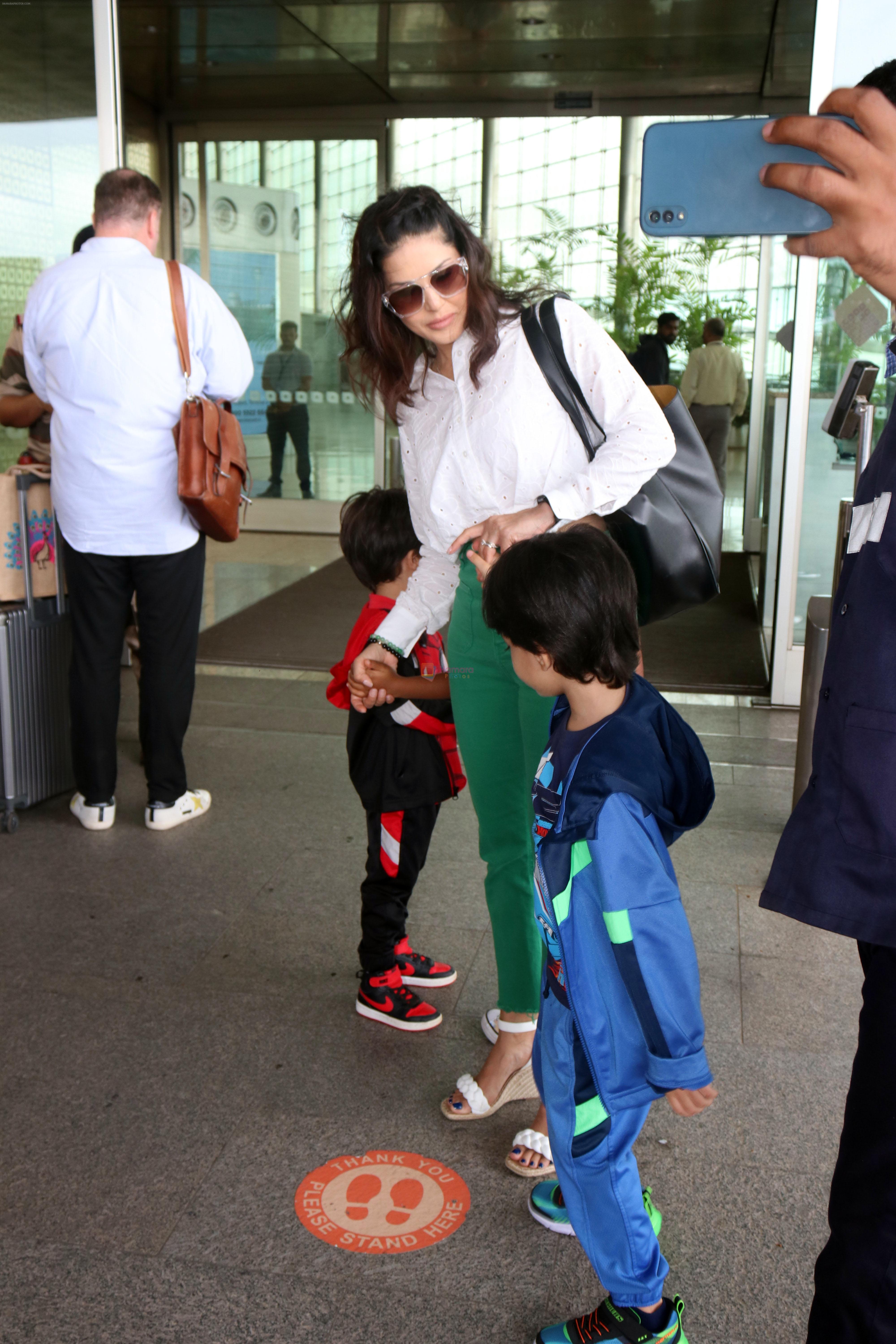 Sunny Leone with kids Asher, Noah seen at the airport on 7 July 2023