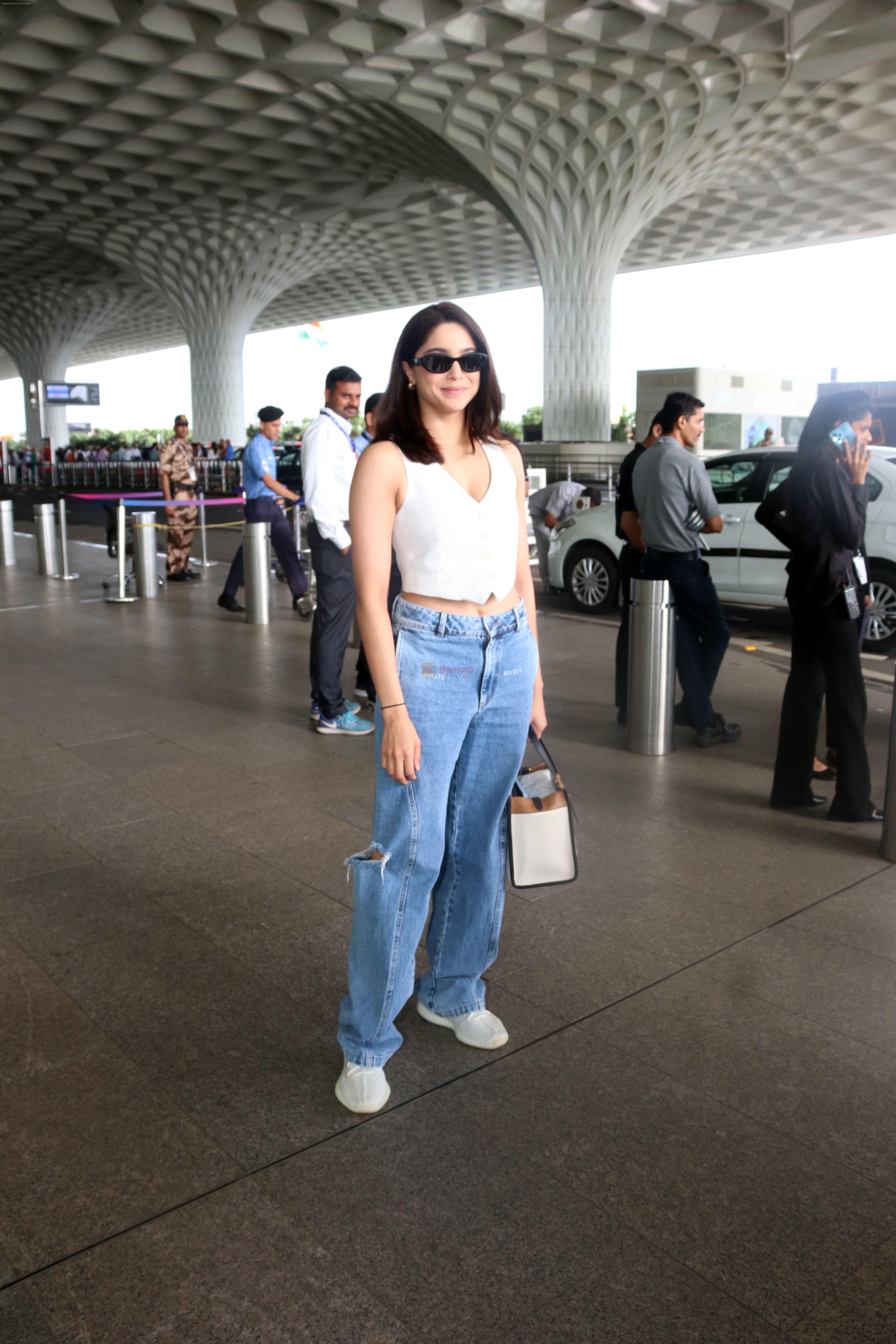 Sharvari Wagh dressed in white sleeveless top and blue jeans seen at the airport on 11 July 2023