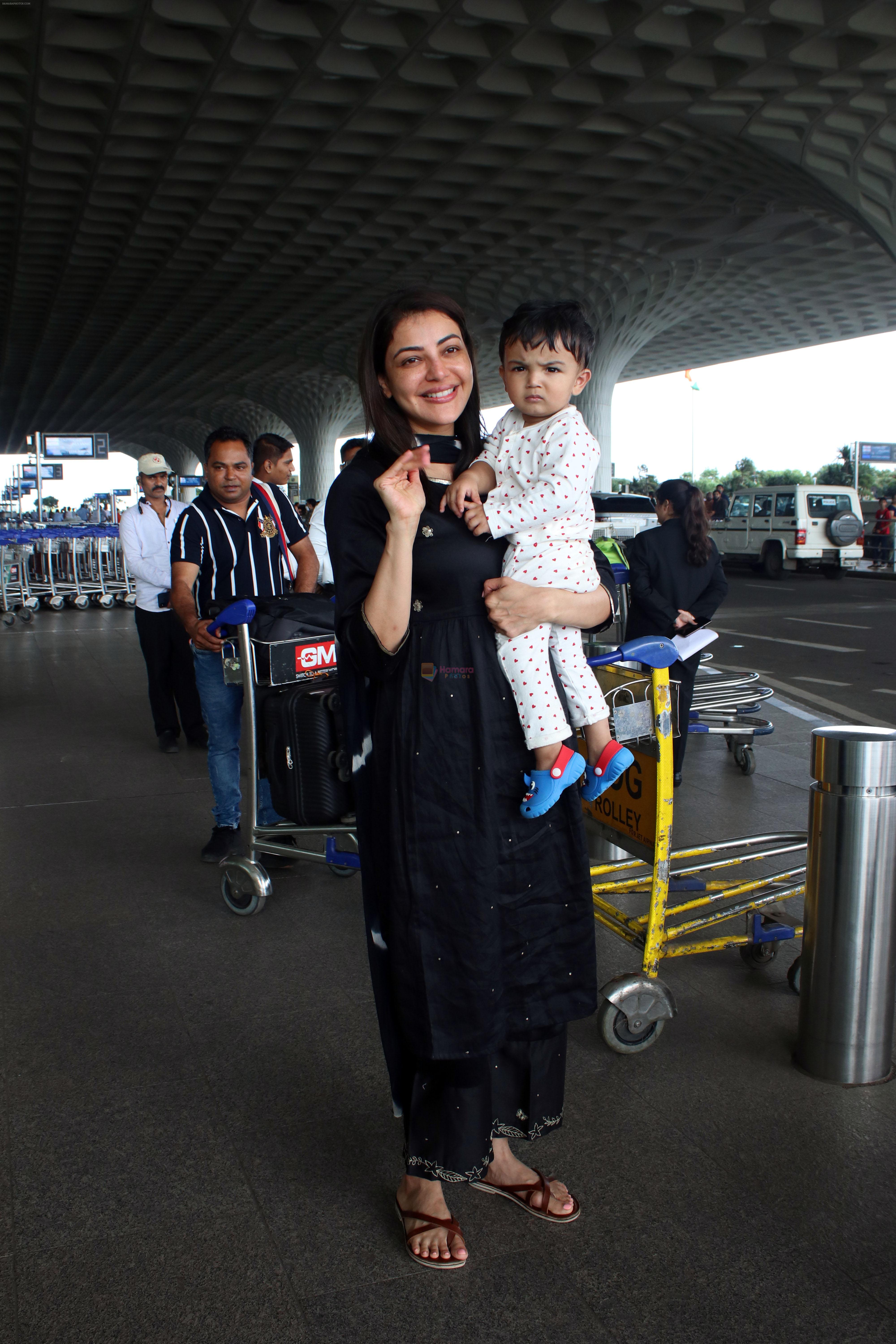 Kajal Aggarwal with her son Neil Kitchlu Spotted at the Airport Departure on 17th August 2023