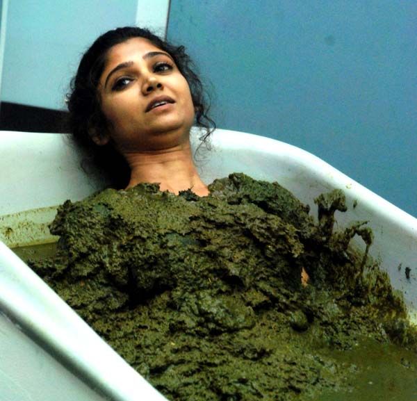 Ratan Rajput in bathtub full of cowdung
